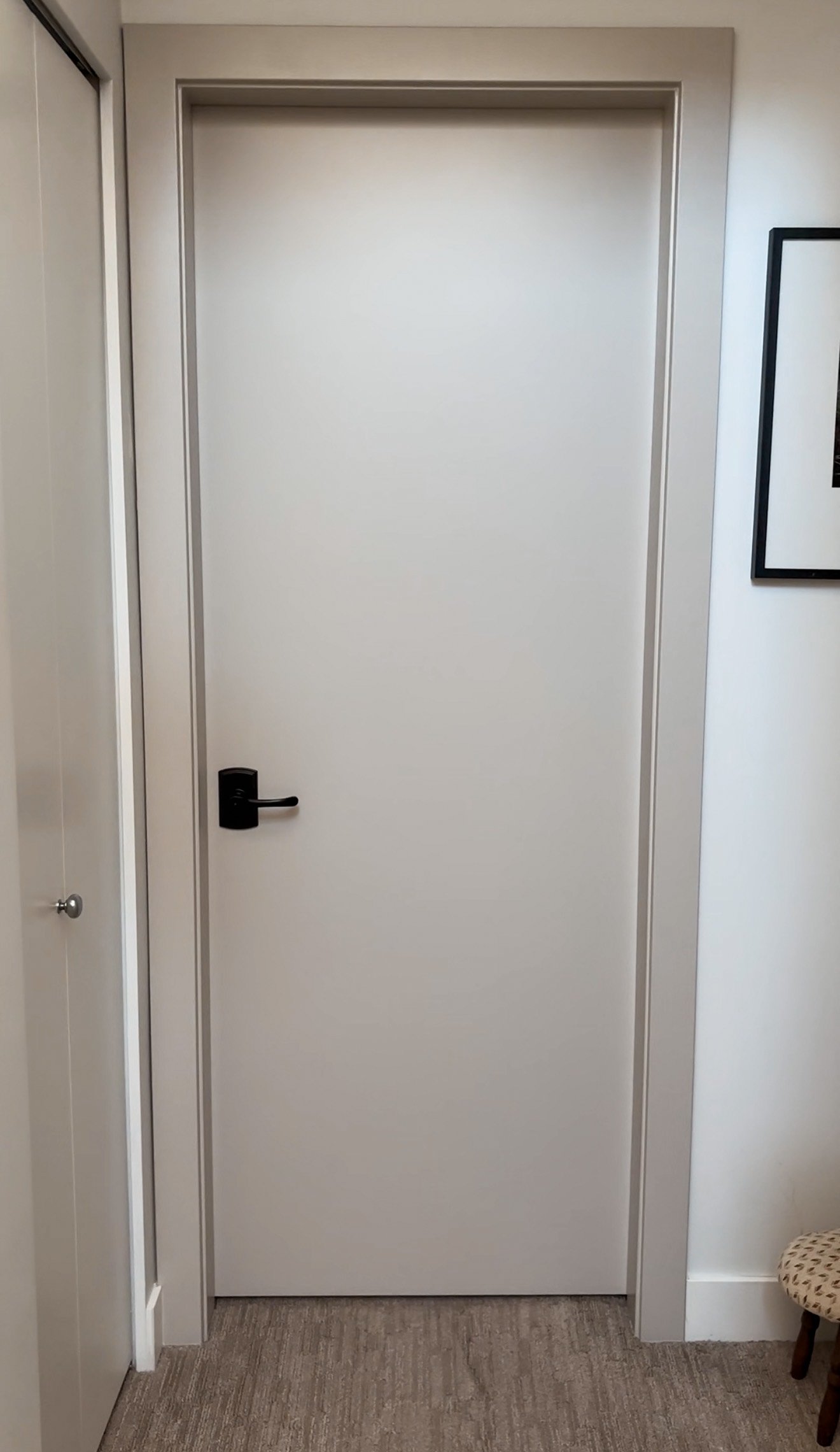 Benjamin Moore Rever Pewter interior doors with a white hallway