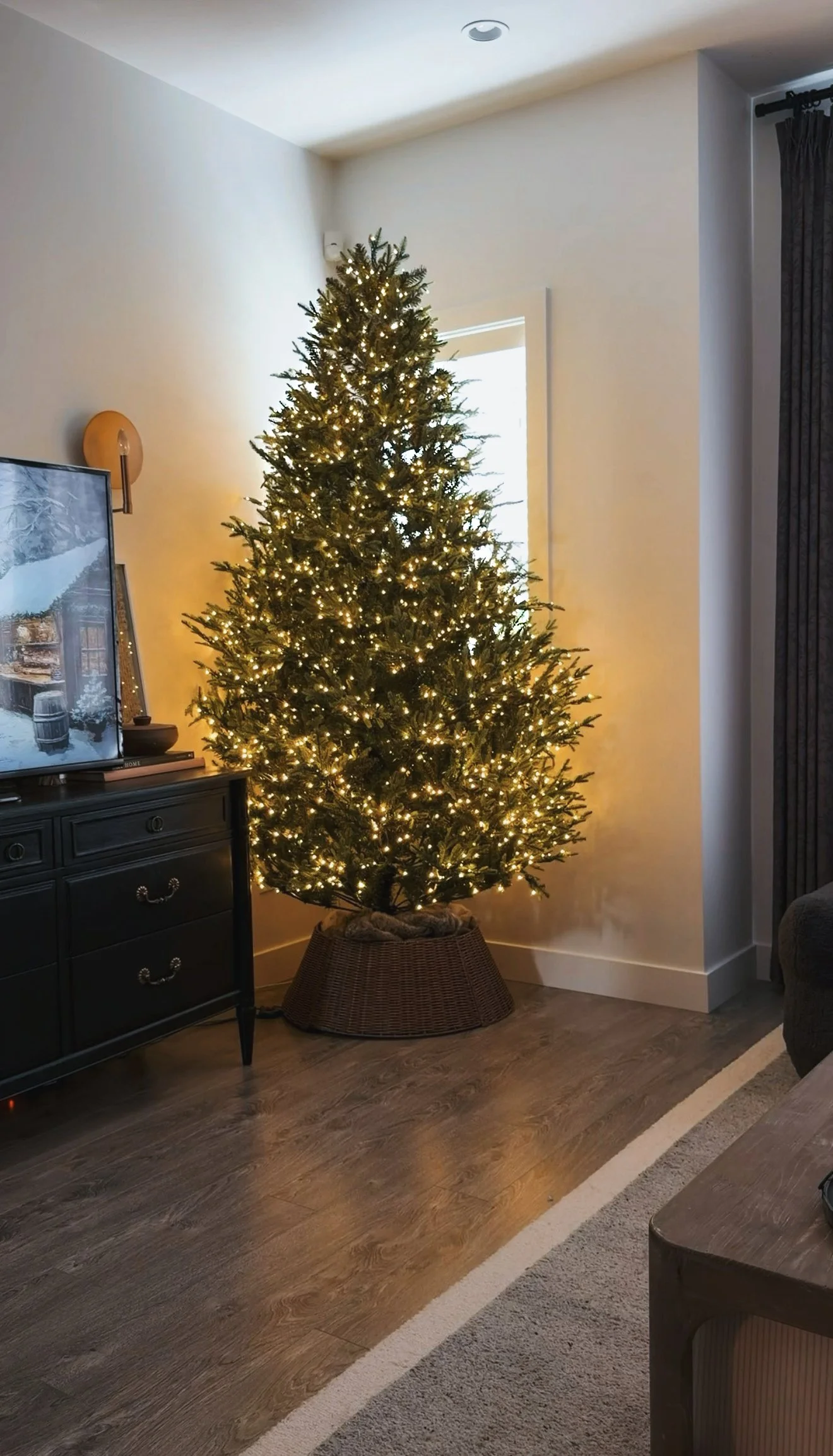Wicker tree collar right side up around a Christmas tree stand before the hack