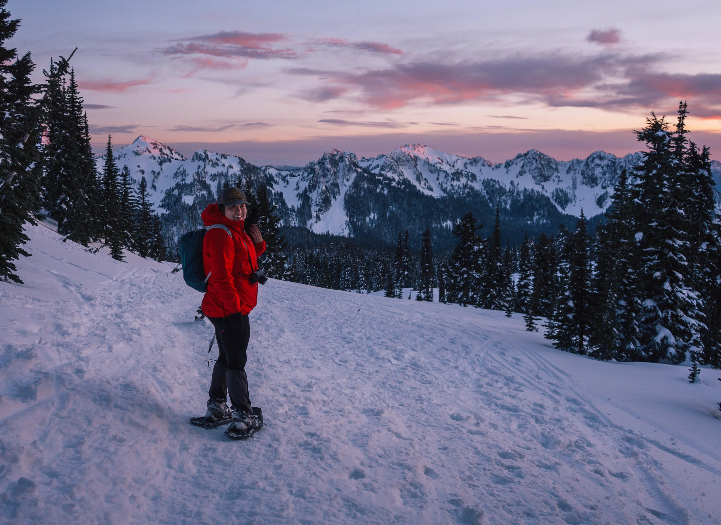 Doris with the Tatoosh Range lit up behind her