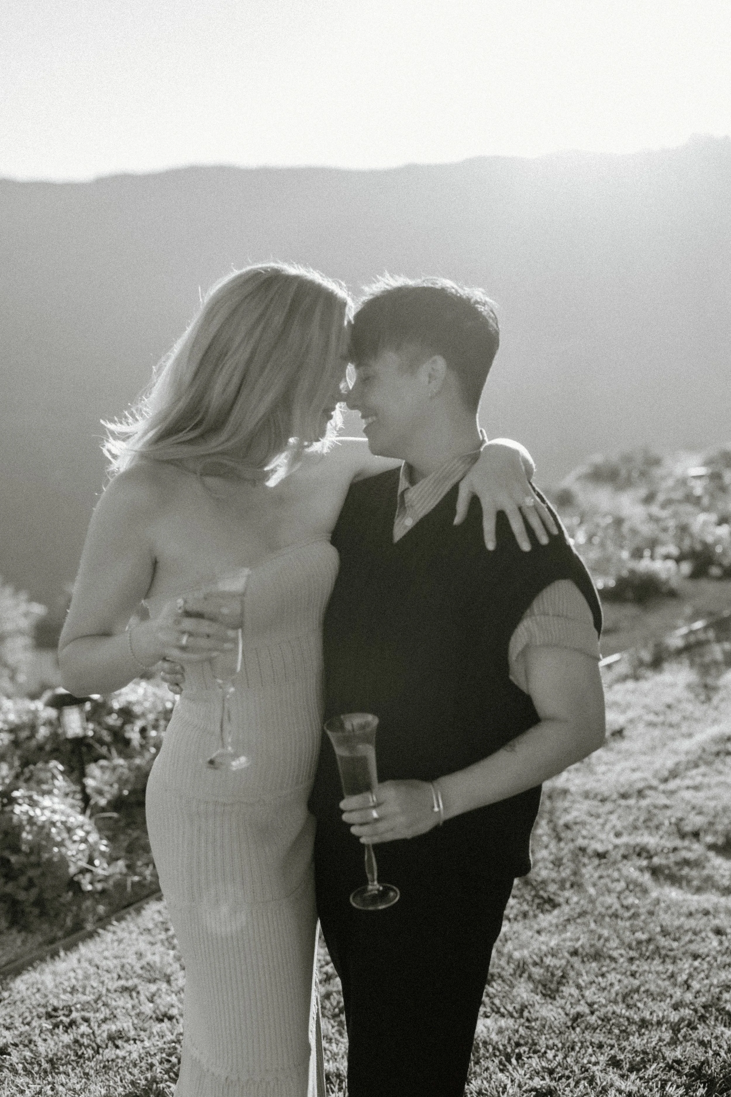 black and white image of engaged couple in Malibu