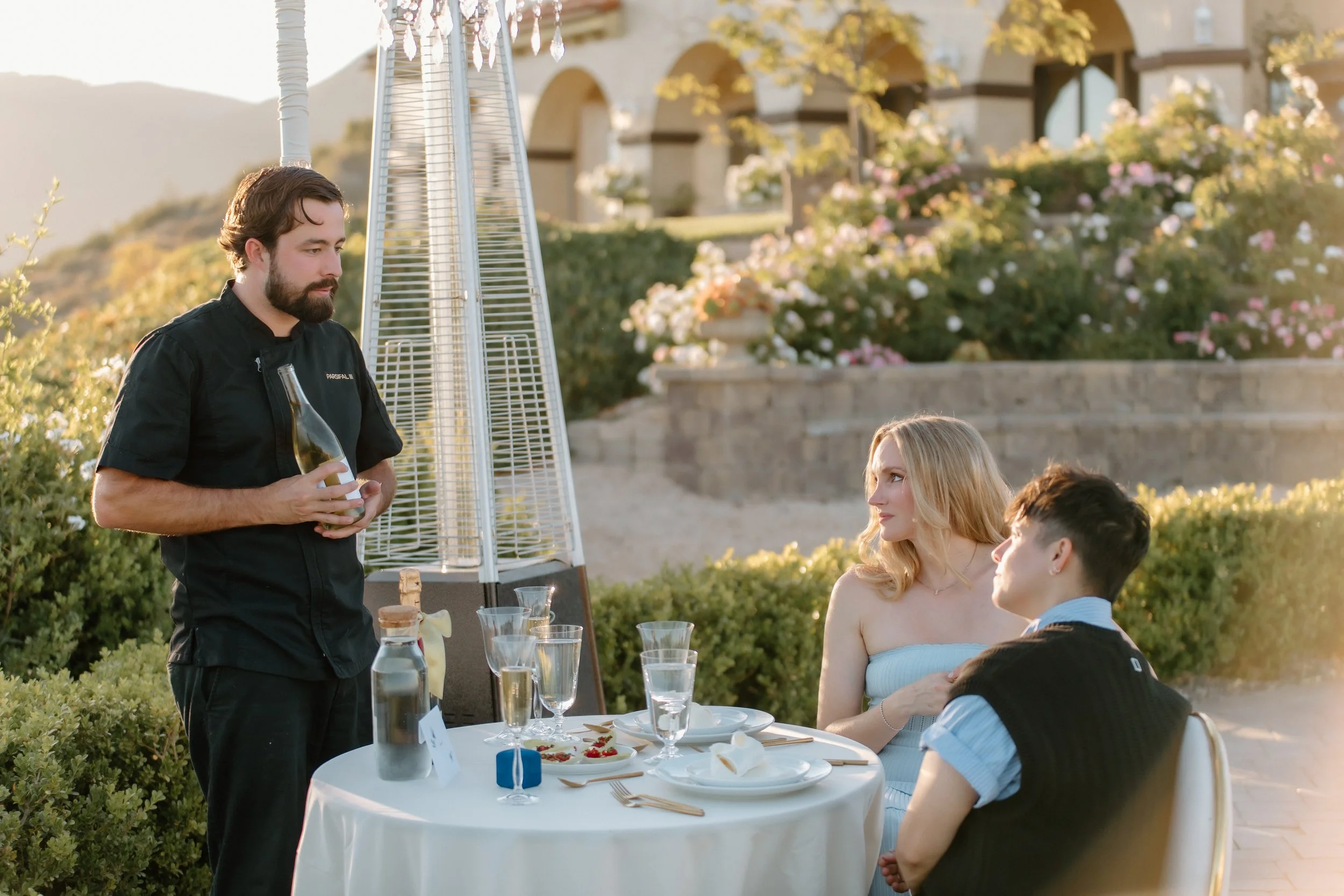 Chef Cloyce Martin pours couple champagne