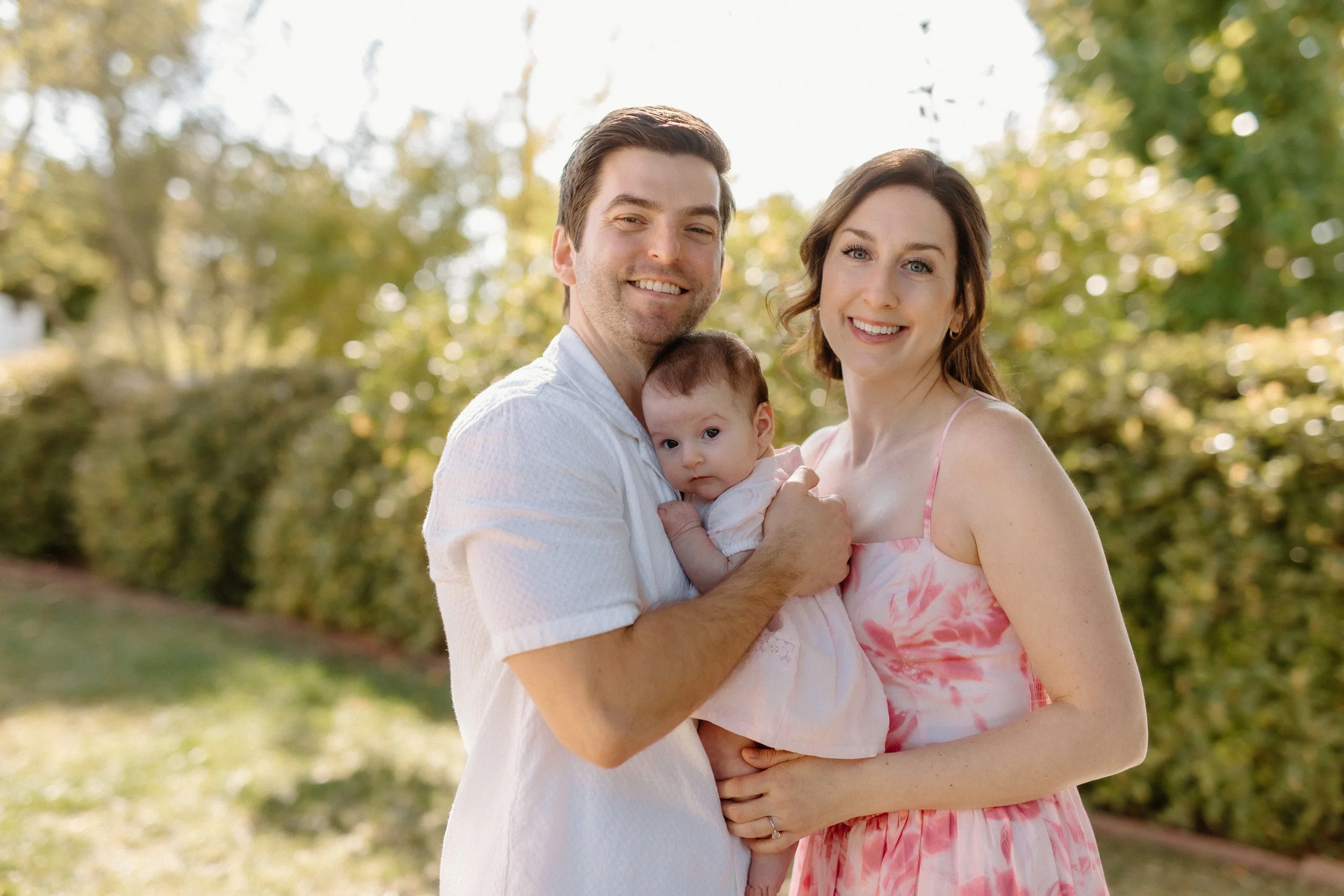 Parents with baby in garden in Palos Verdes