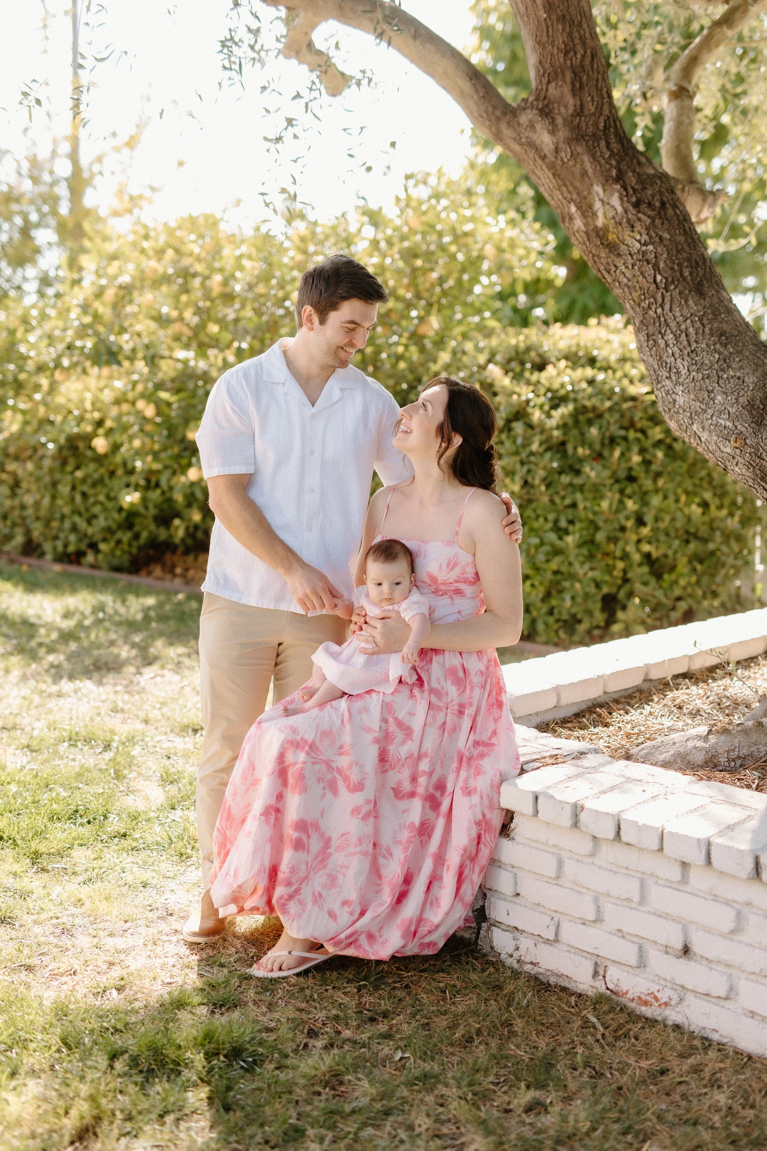 Parents with baby in backyard
