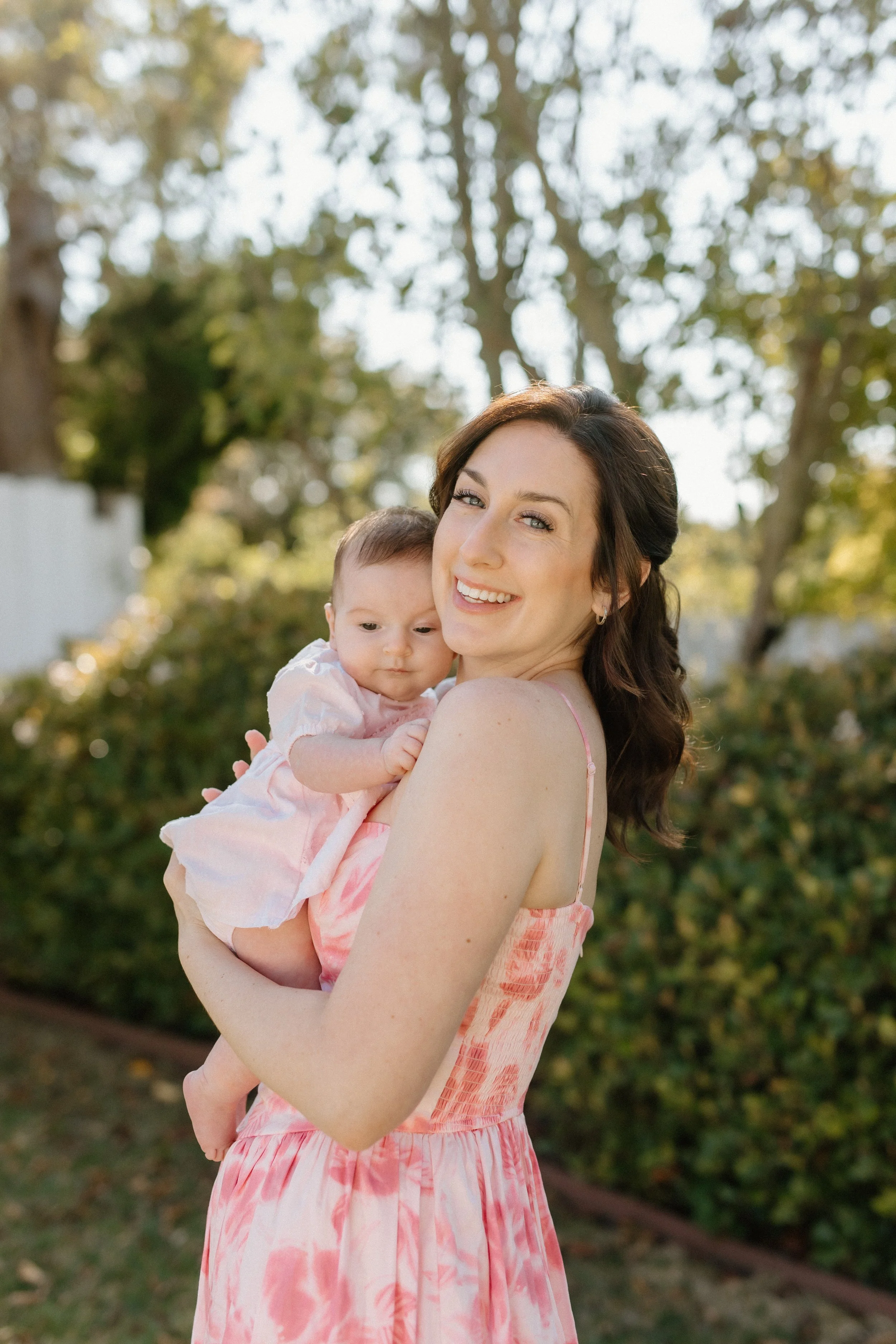 Mother and baby in garden