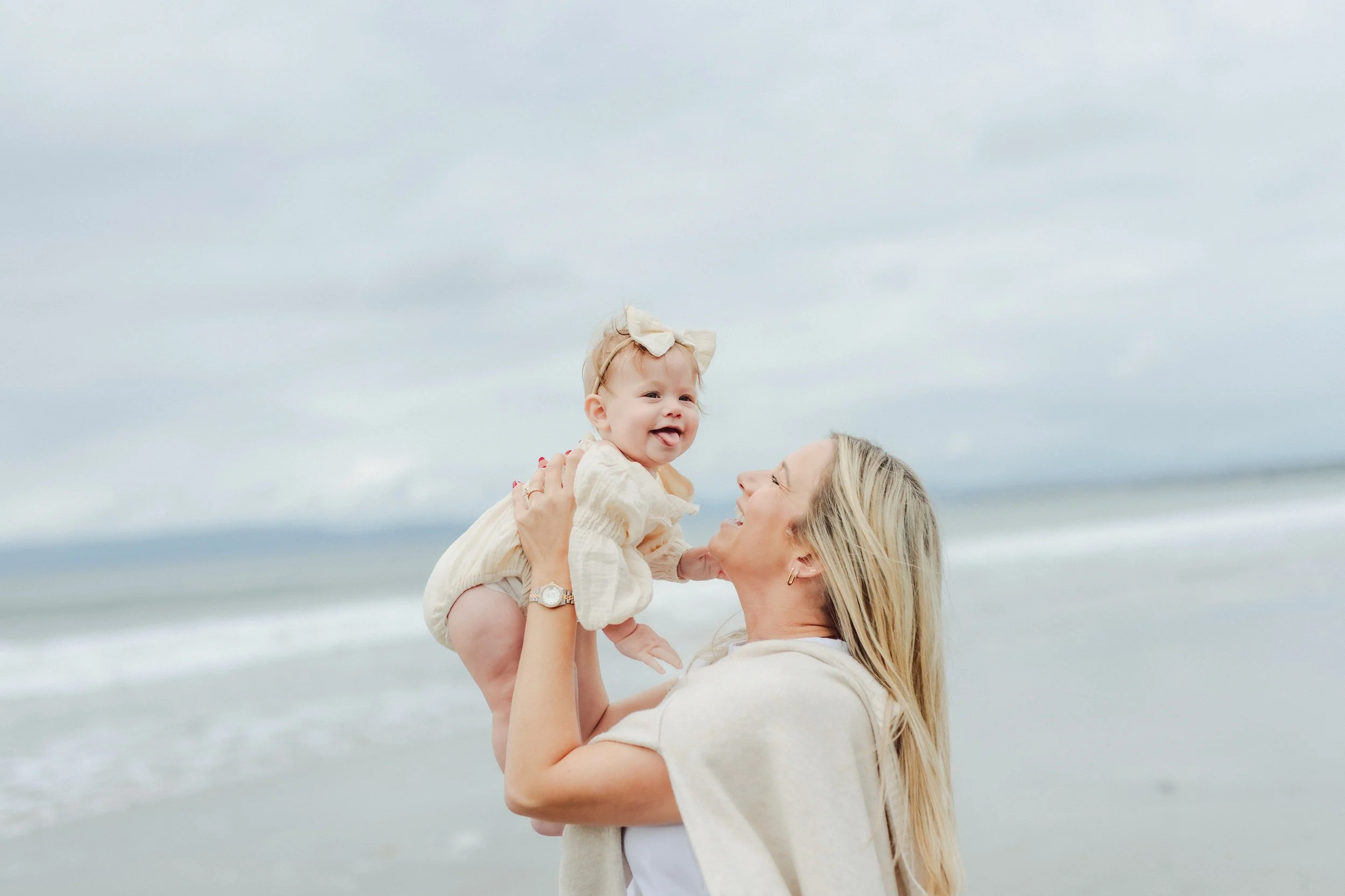Mom adores new baby on the beach in California