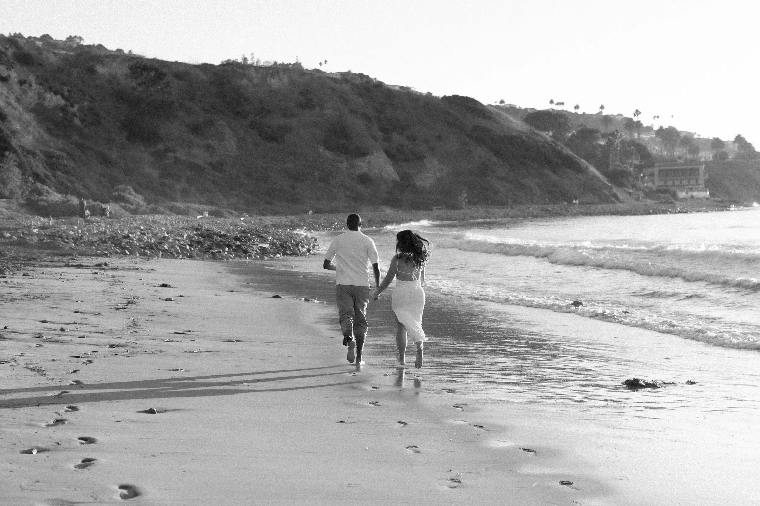 run on the beach during engagement session