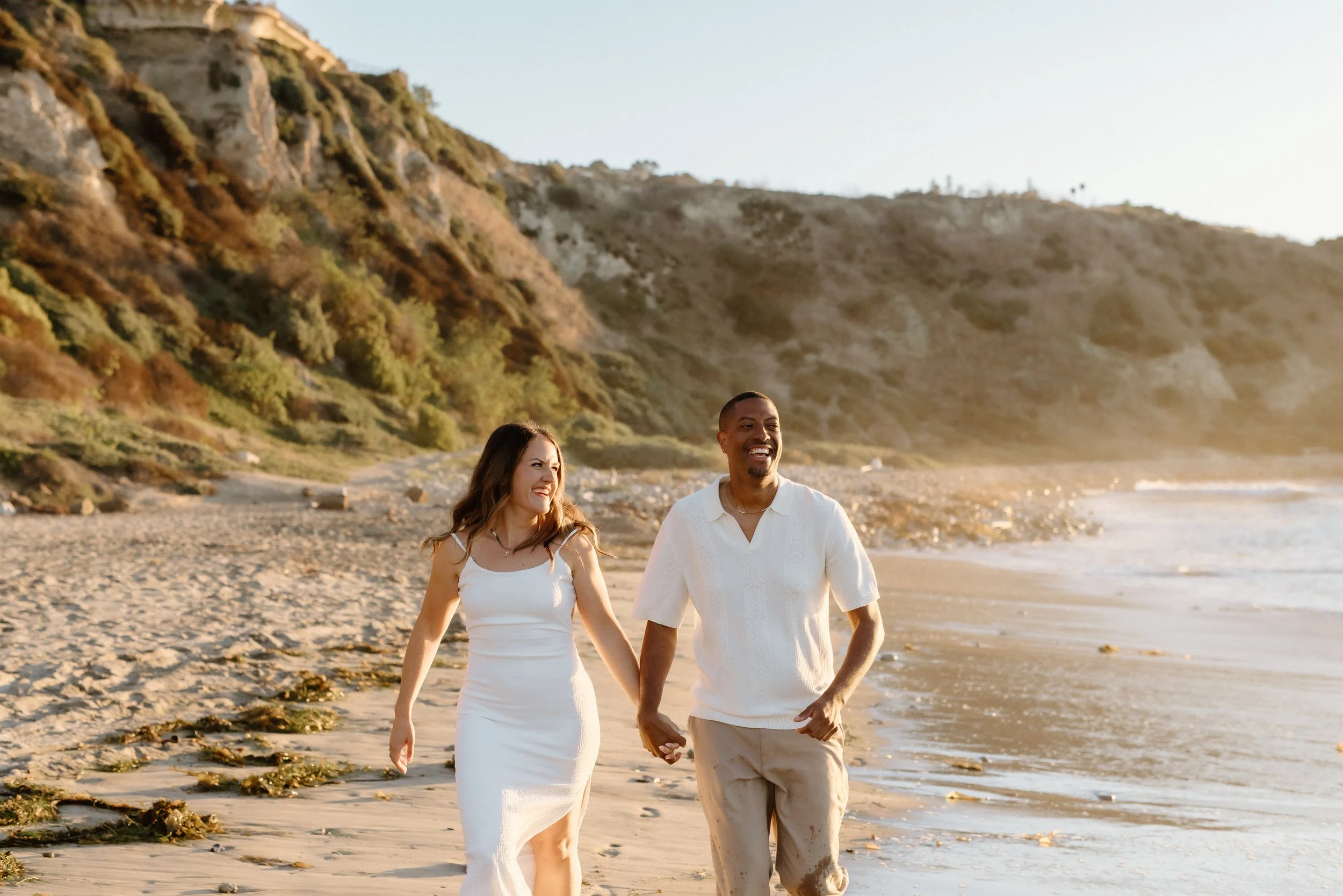 running on the beach engagement session
