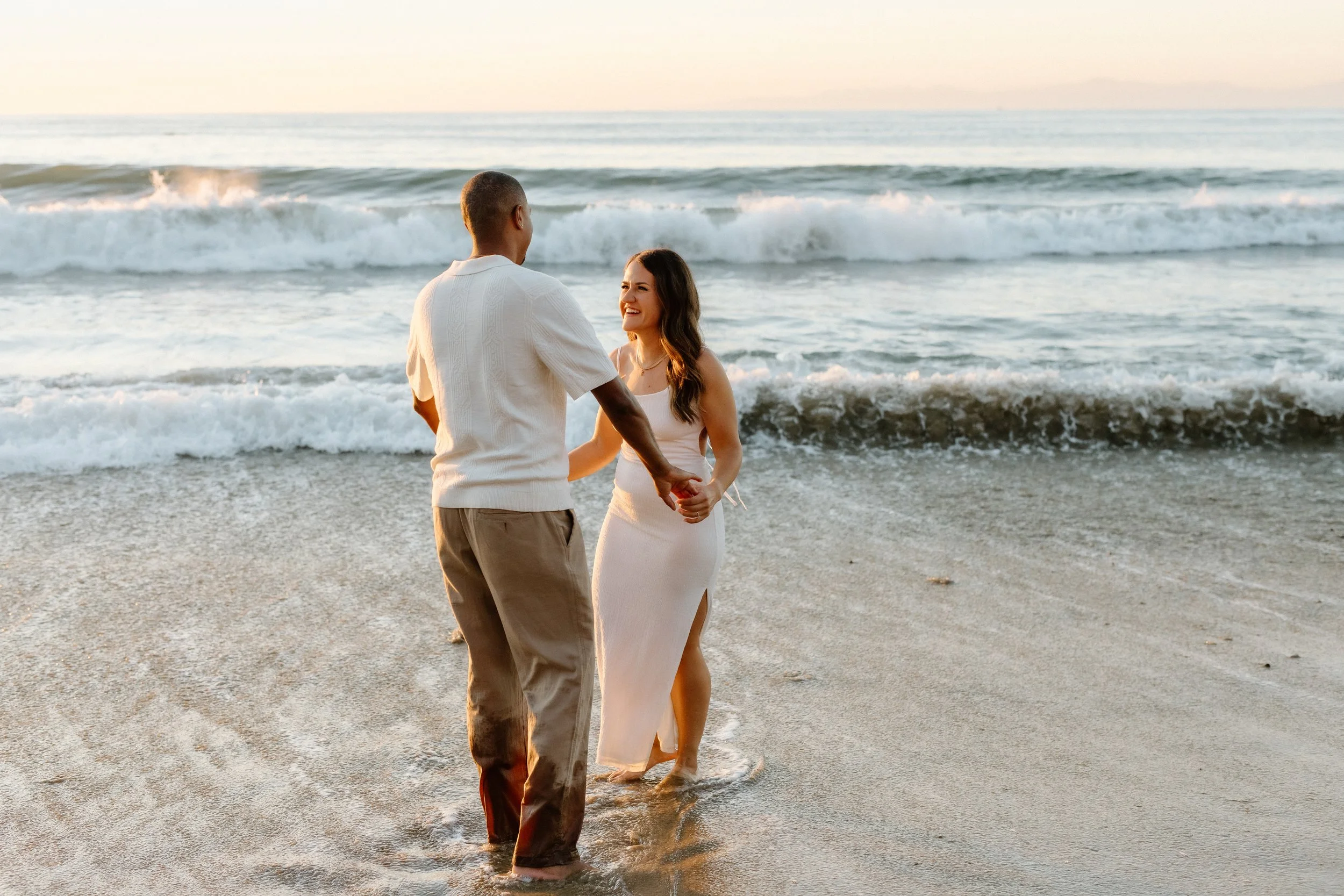 romantic engagement session in the waves