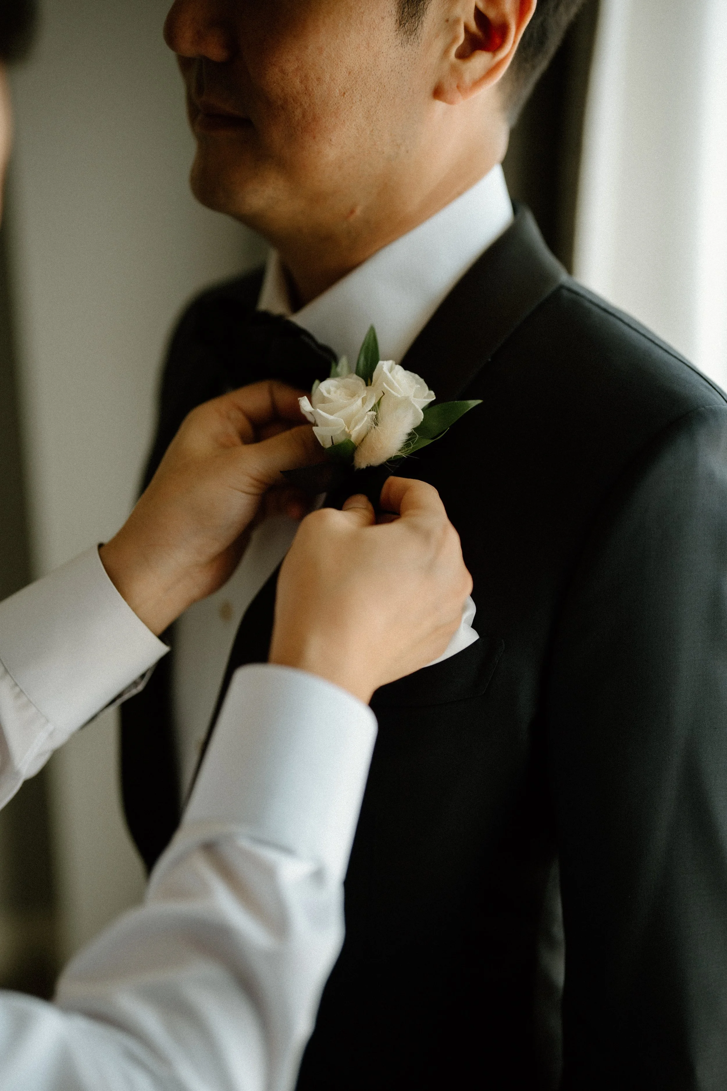 Whit ranunculus boutonniere from The Flower Lab Los Angeles