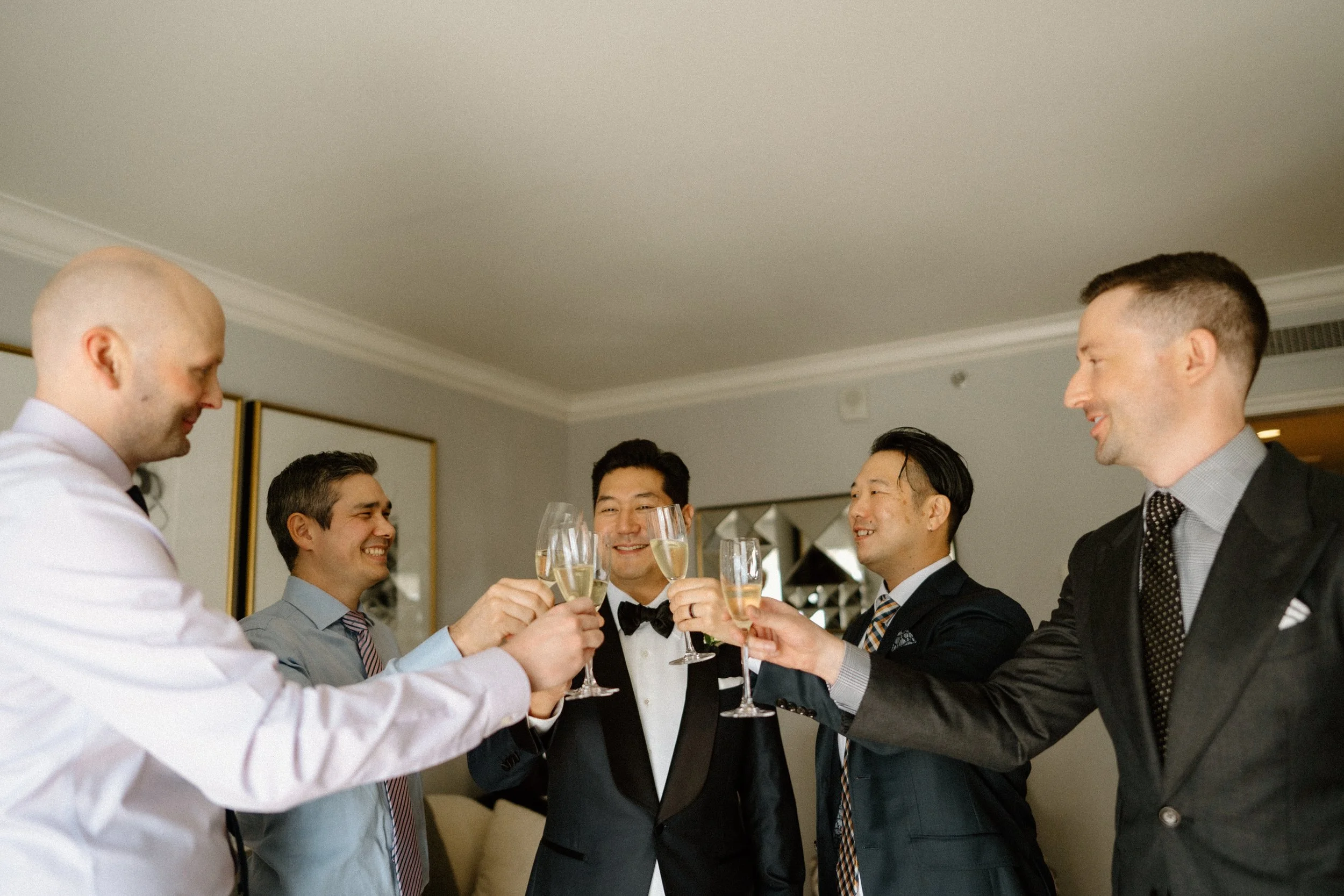 Groom and groomsmen toast to friendship and  the future happiness of the couple