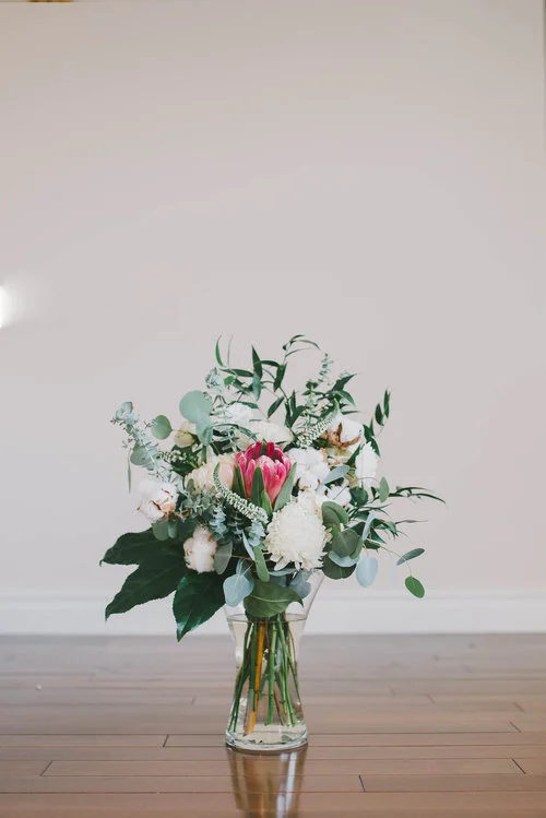 Flower Arrangement will be a Custom piece created for you with Fresh Seasonal Flowers! Just to Check out this amazing arrangement from Bethany Ann Flowers & Styling Portfolio