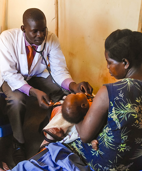 NUMEM Health Centre’s clinical officer assessing an infant, March 2016.