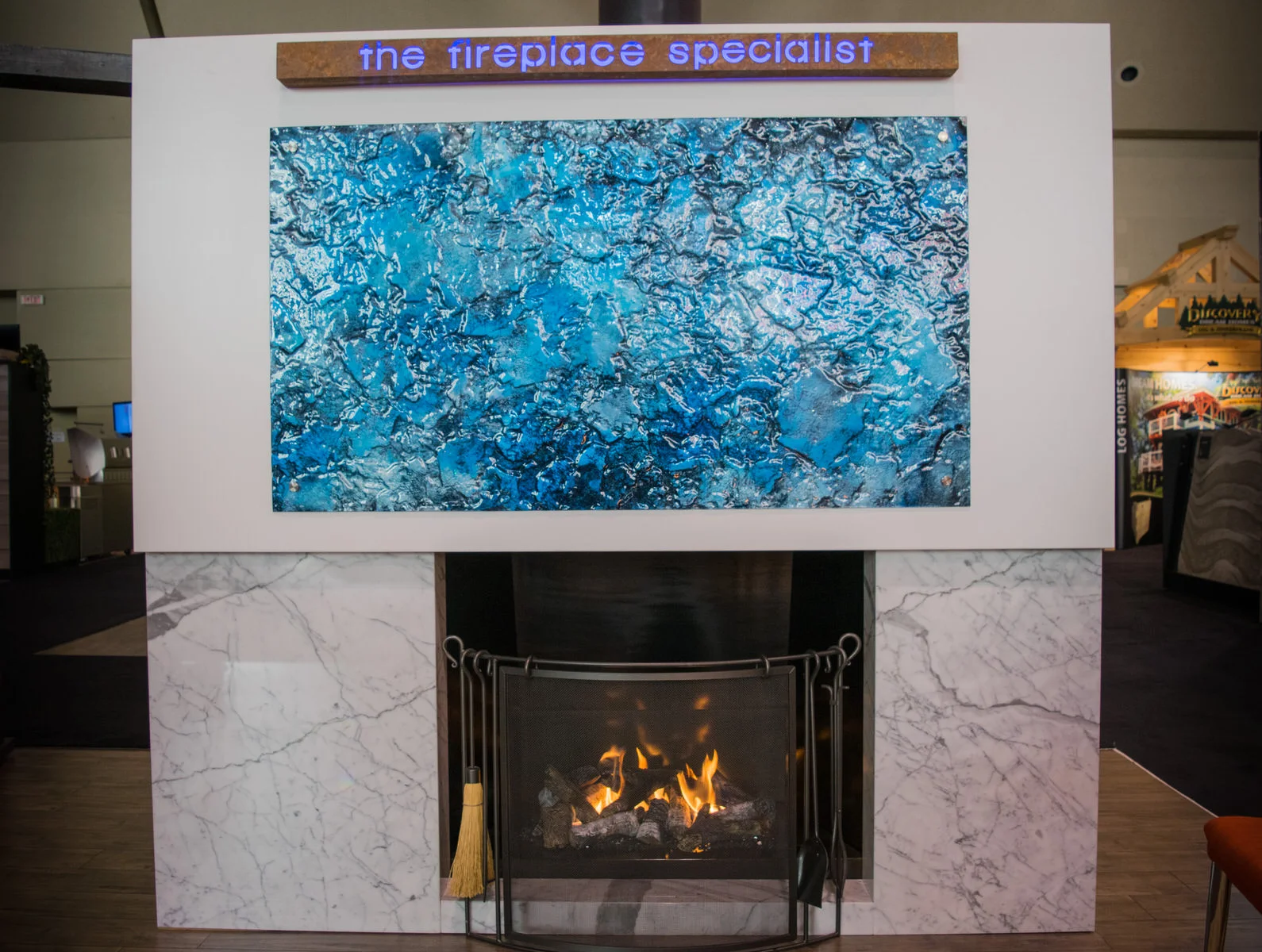 Plantation woodburning fireplace with Peterson natural gas log set conversion and calacutta marble surround