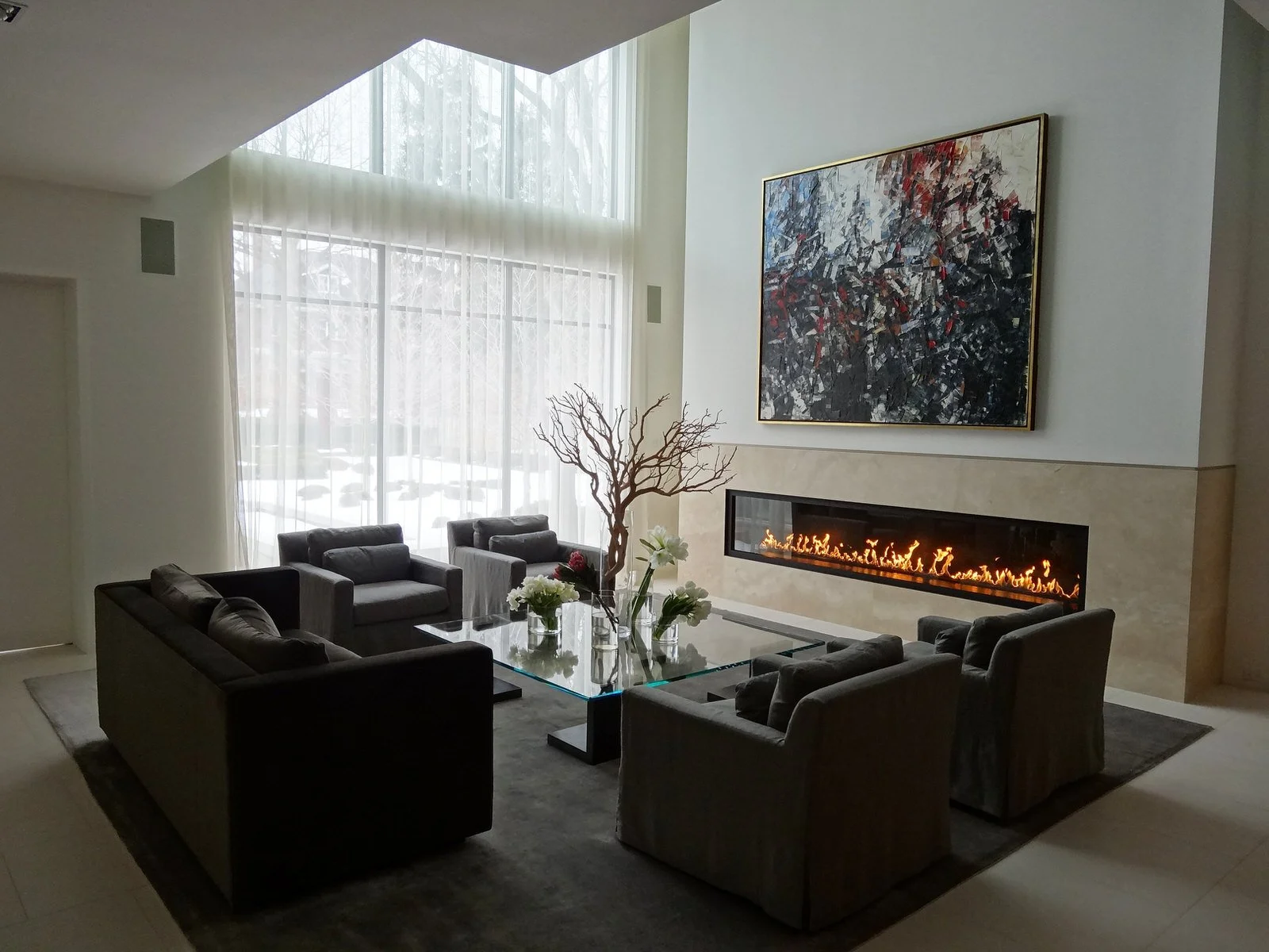 Custom 10 foot Montigo direct-vent gas fireplace installed in a modern living room