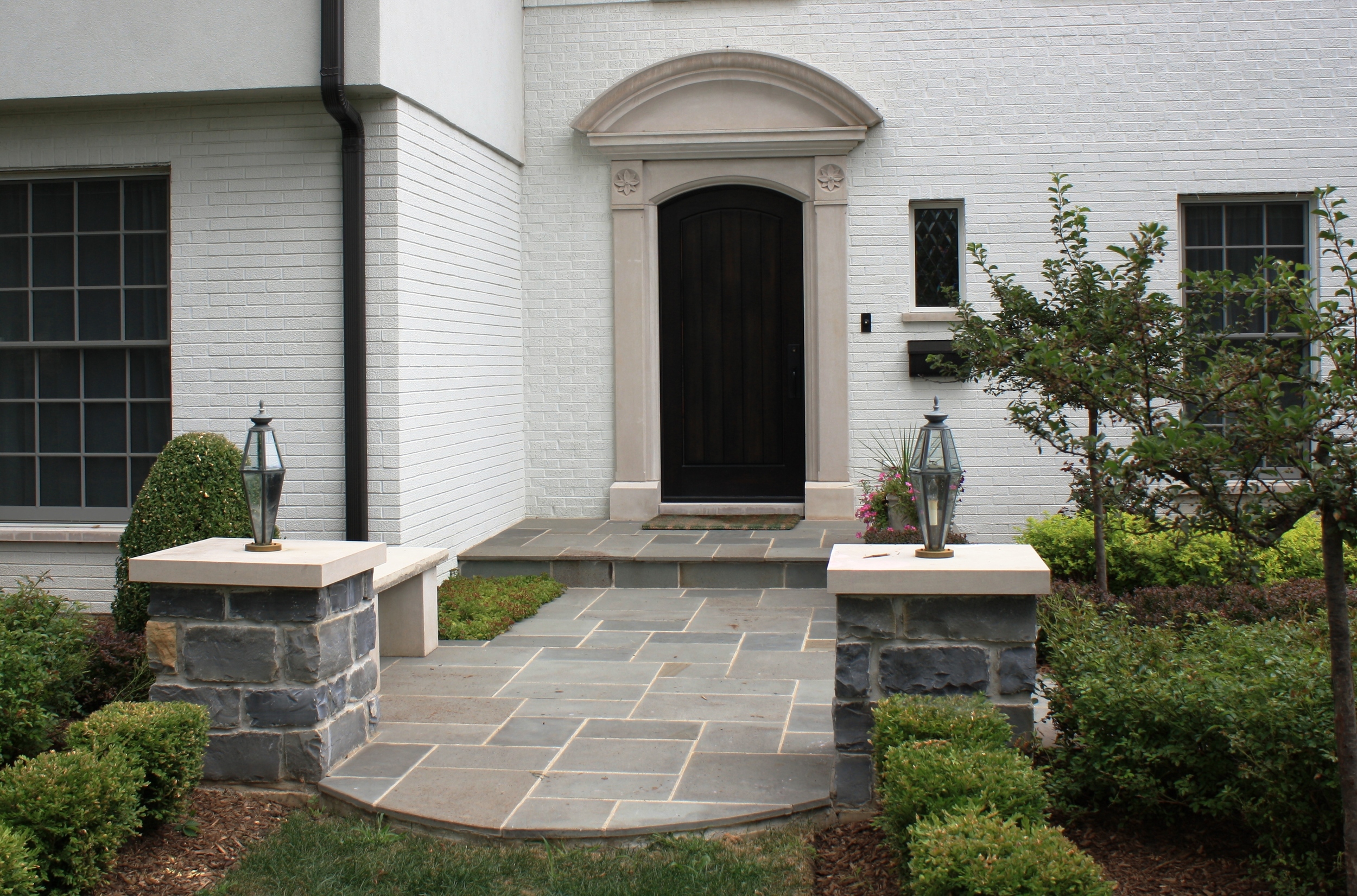  Limestone around the entrance door, bluestone walkway and stone columns. Clarendon Hills, IL 