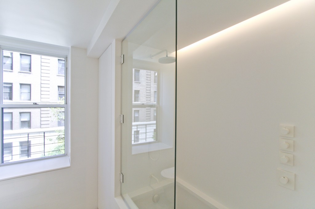   Kids' bath with full corian tub enclosure  