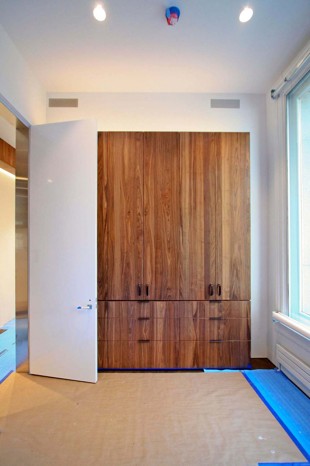    Guest Bedroom &nbsp;- Built-in Walnut wardrobe and nearly 11-foot tall high-gloss white lacquer door with stainless steel door frame.  