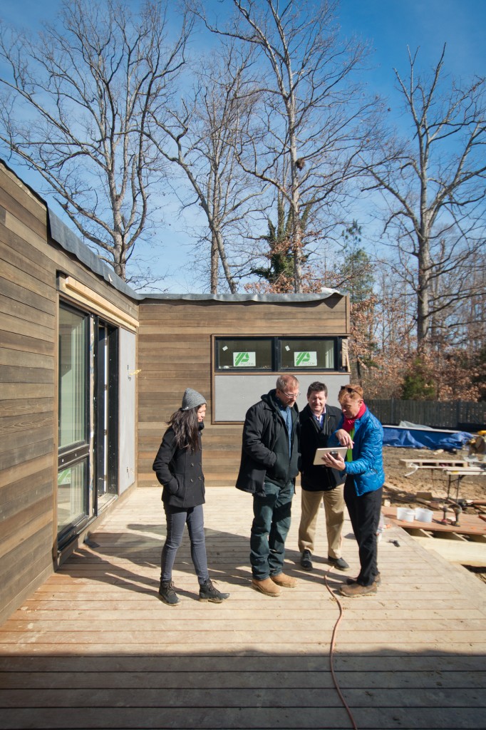   Architects and contractor discussing design details  