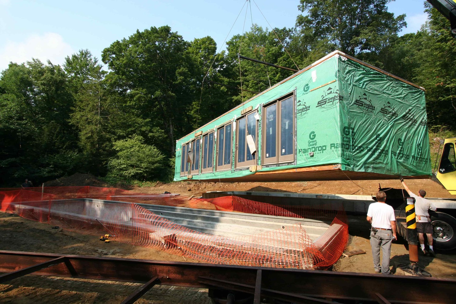    View of the pool house being set into place   