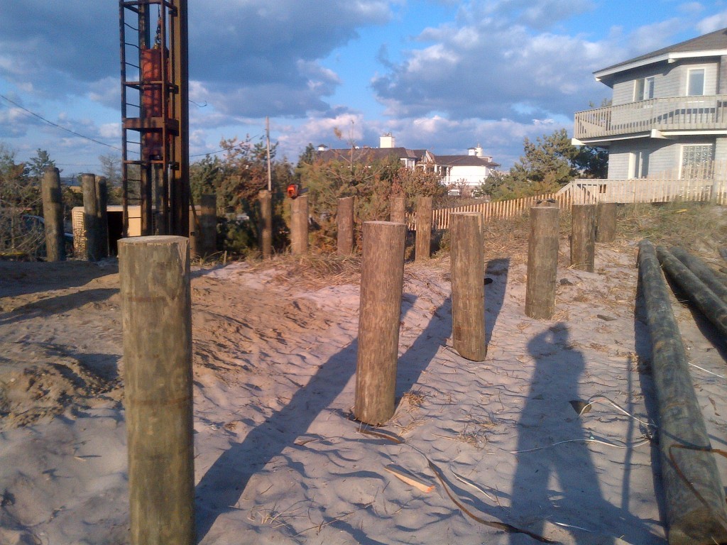   View of machine pile driving the wooden piers  