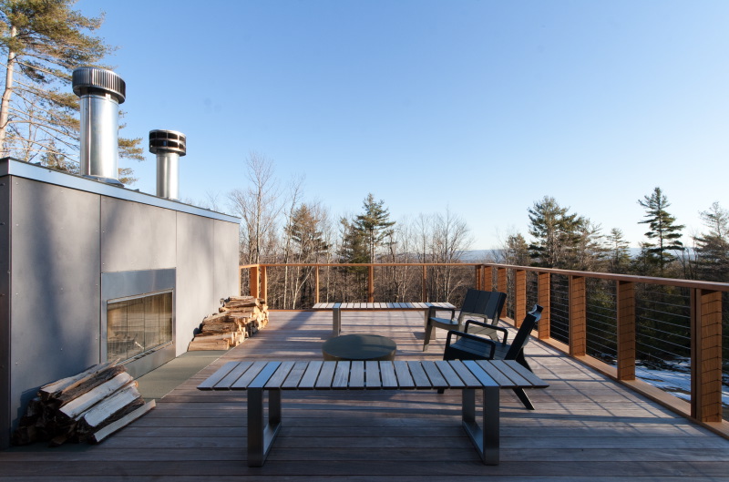   Roof deck with outdoor furniture and firewood  