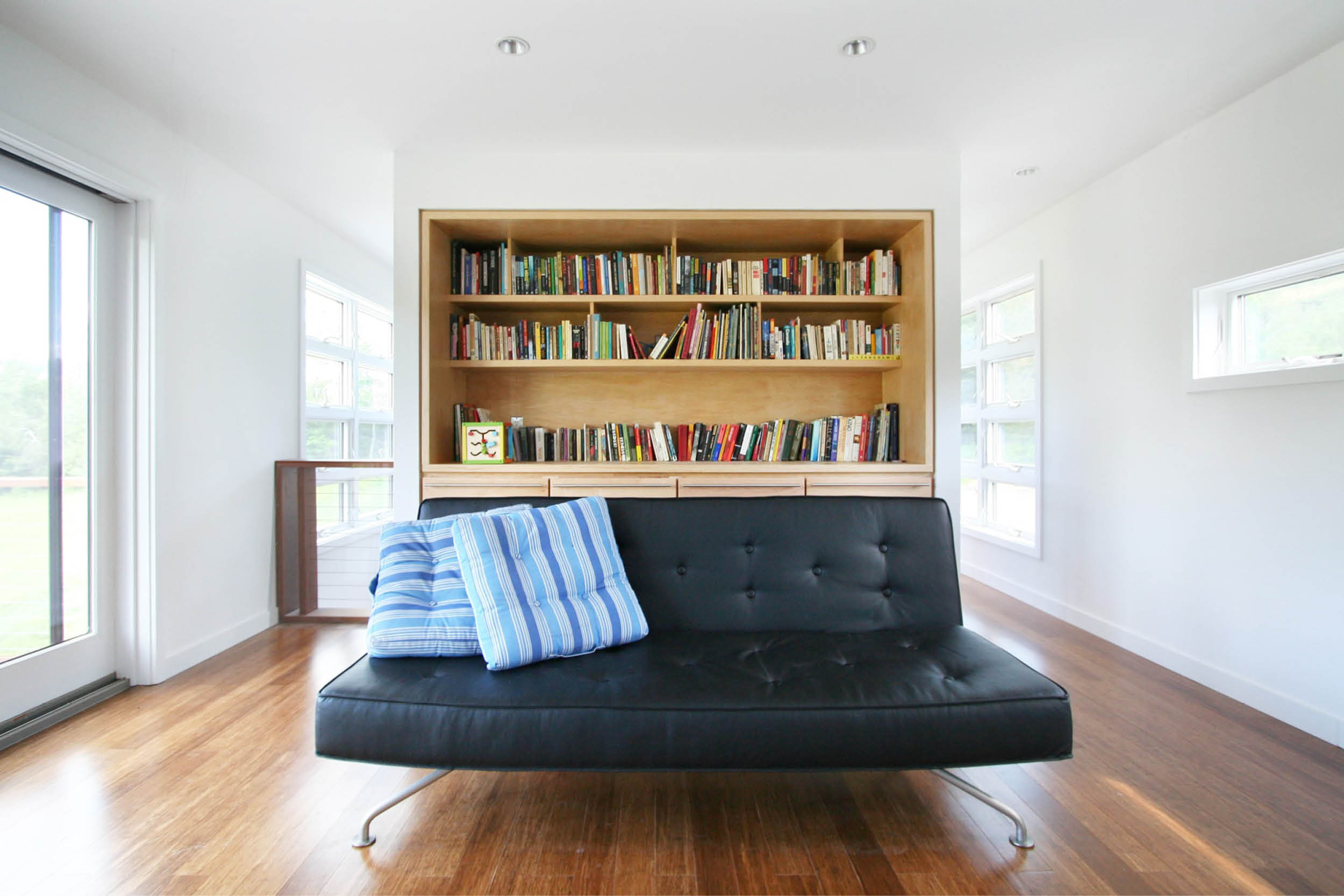 Modern Modular Prefab Meadow House | New York State | Living Room Custom Built In Cabinets Sliding Doors White | RES4