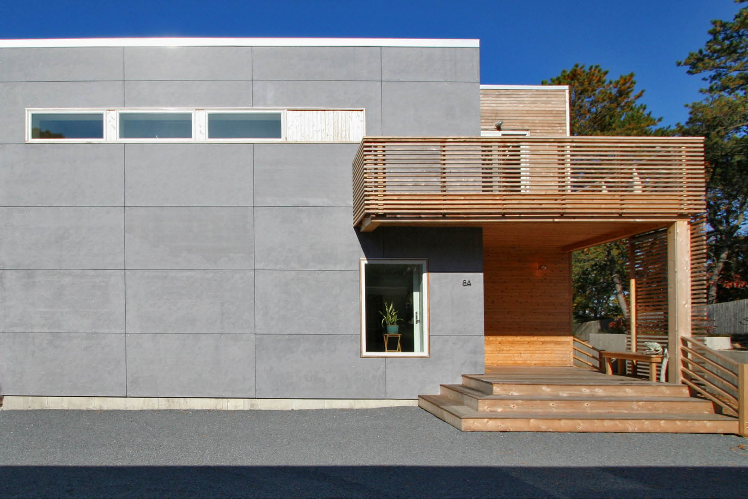 Modern Modular Prefab Peconic Bay House | Shinnecock Hills Hamptons New York | Cedar Cement Board Siding White Windows Deck Cedar Screen Rail | RES4