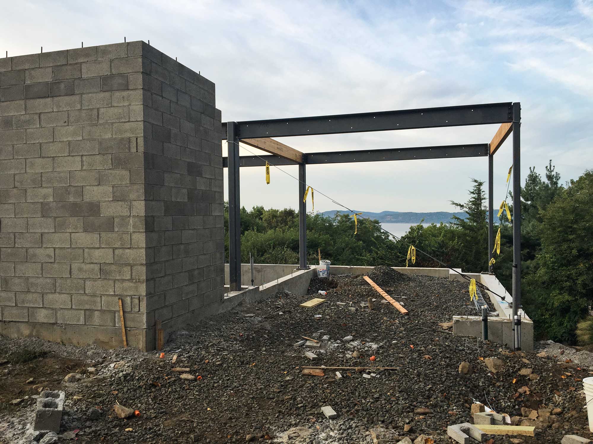 Carport & Entry -- The future driveway will slide below the house and frame a fantastic view of the Hudson River beyond.