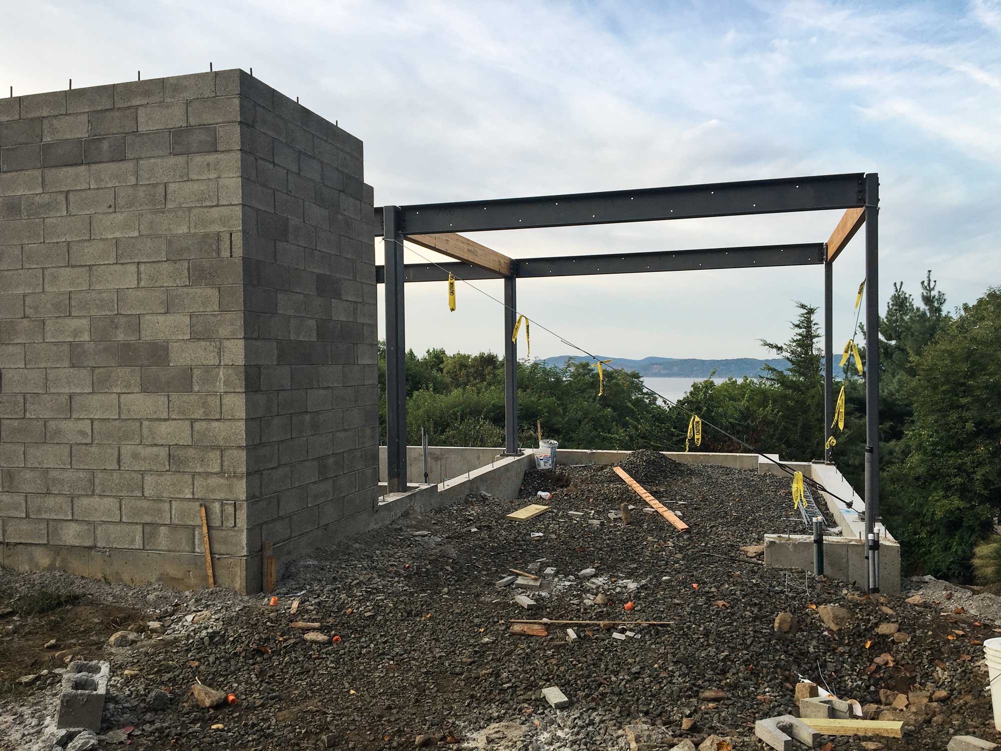   Carport &amp; Entry  --  The future driveway will slide below the house and frame a fantastic view of the Hudson River beyond.  