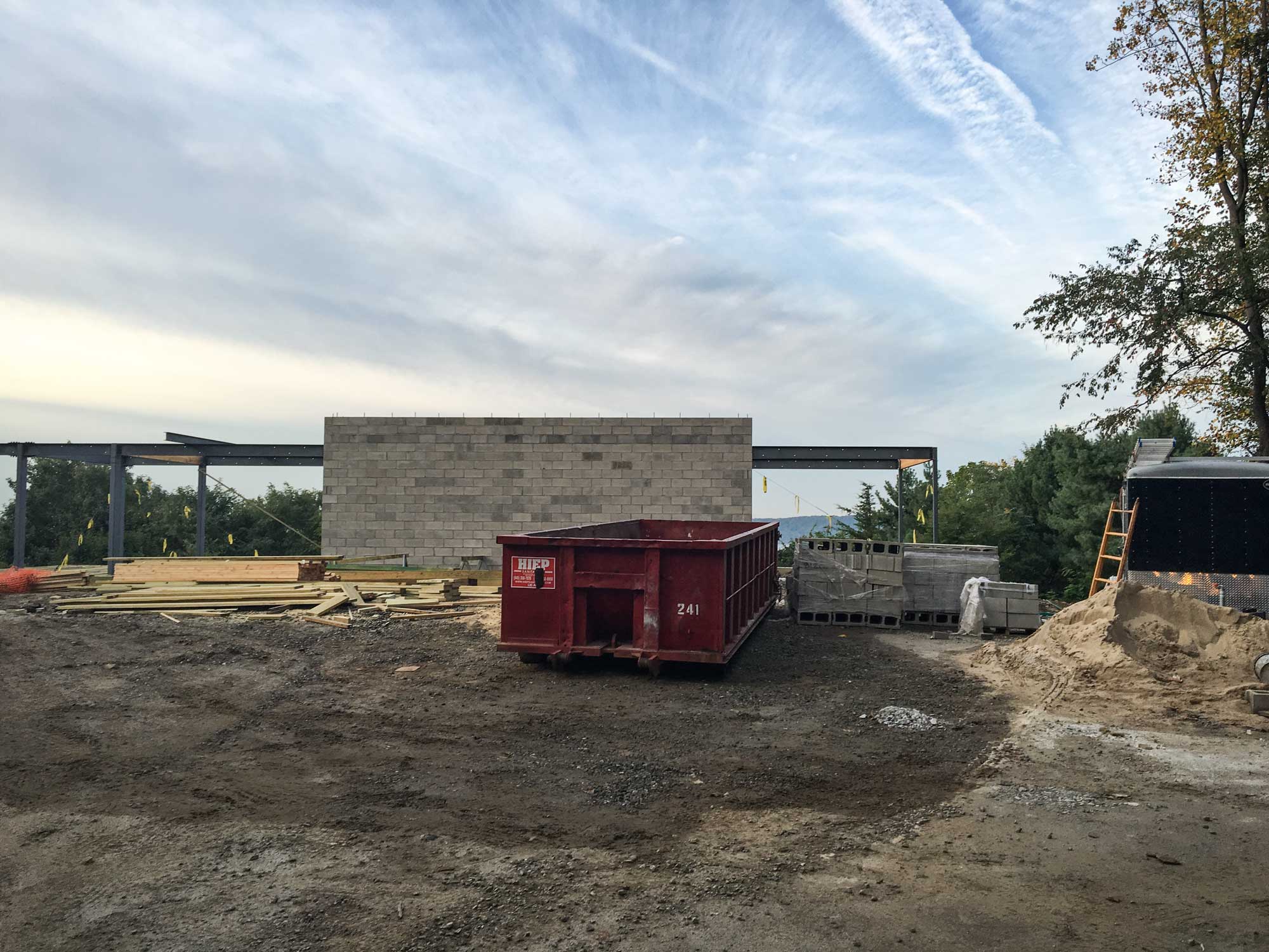   Circulation Volume  --  The CMU wall wraps a stair and elevator core that will take users up to the main floor of the house above.  