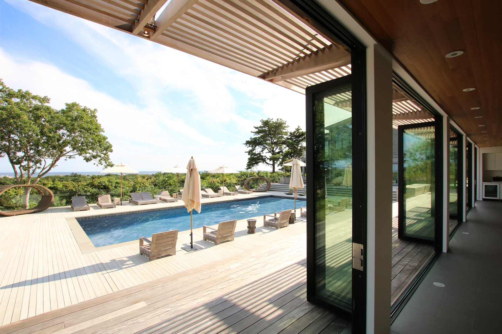 res4-resolution-4-architecture-modern-modular-house-prefab-amagansett-addition-exterior-pool-deck-terrace.jpg