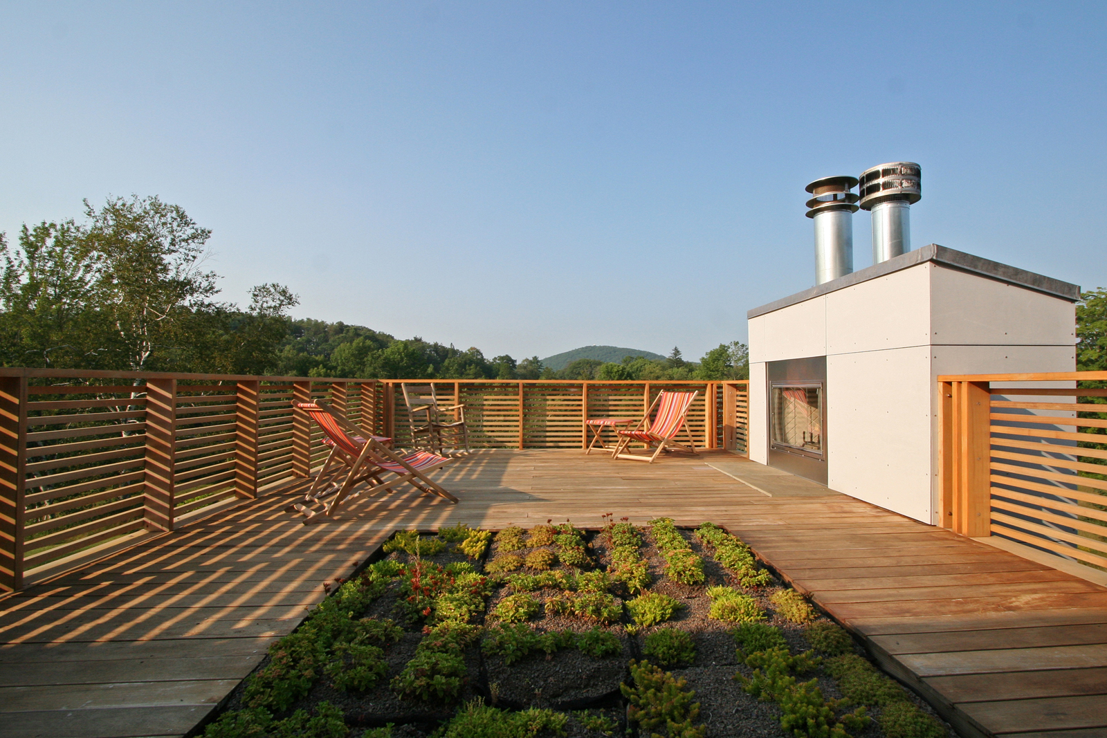16-res4-resolution-4-architecture-modern-modular-home-prefab-sunset-ridge-house-exterior-terrace-fireplace-lounge.jpg