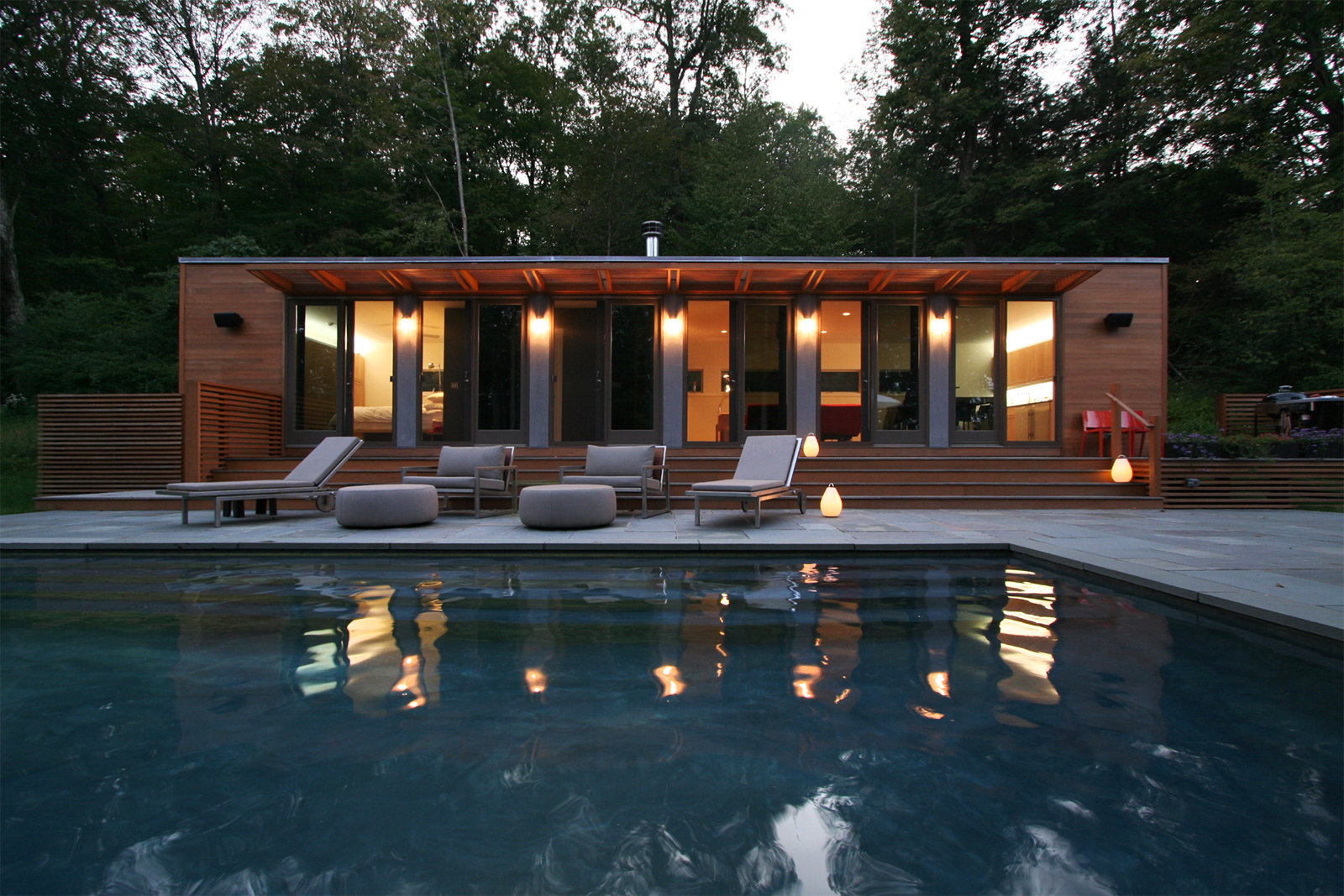 11-res4-resolution-4-architecture-modern-modular-home-prefab-house-connecticut-pool-house-exterior-dusk.jpg