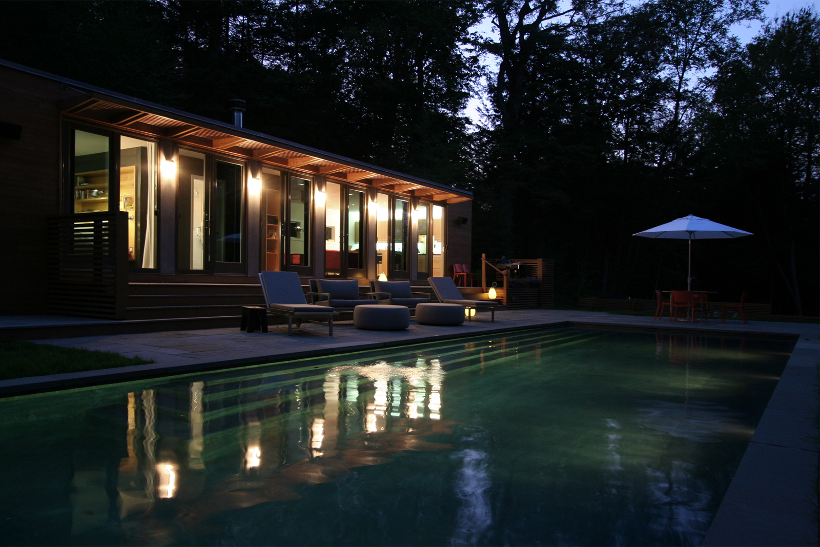 12-res4-resolution-4-architecture-modern-modular-home-prefab-house-connecticut-pool-house-exterior-dusk.jpg