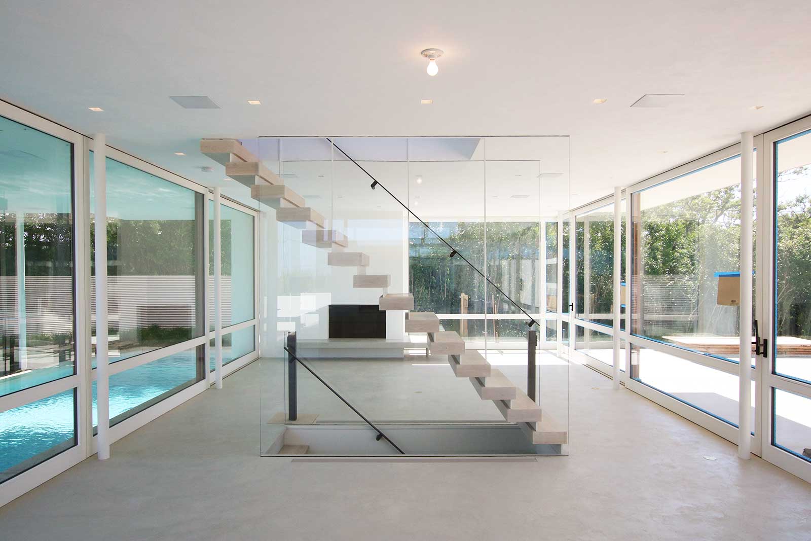 04-res4-resolution-4-architecture-modern-home-surfside-residence-renovation-living-stair.jpg