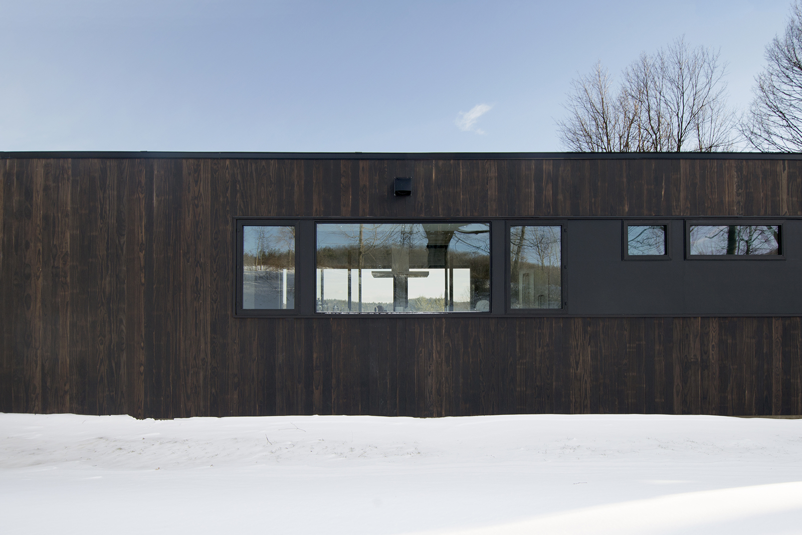 12-res4-resolution-4-architecture-modern-modular-prefab-home-cornwall-cabin-exterior-winter-kitchen-window.jpg