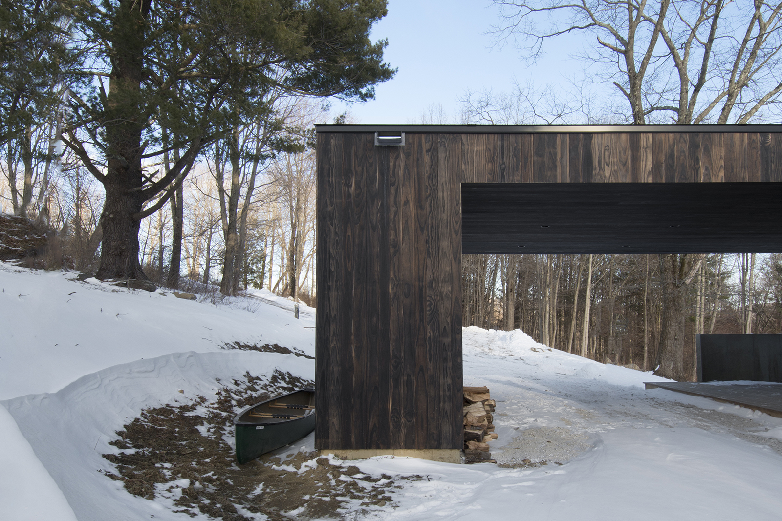 13-res4-resolution-4-architecture-modern-modular-prefab-home-cornwall-cabin-exterior-winter-carport.jpg