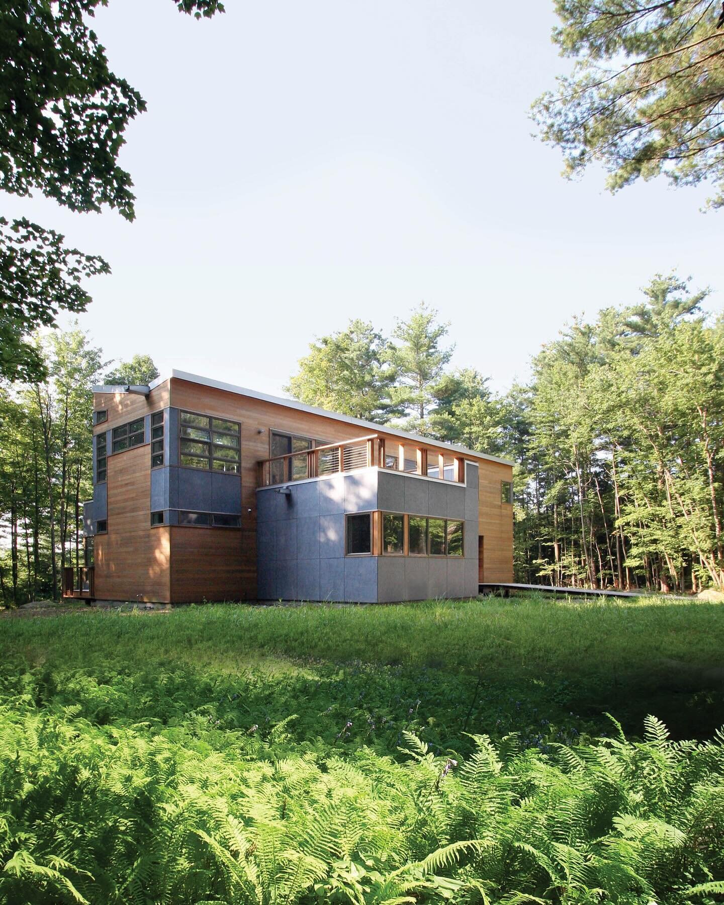 At the Berkshire House, visitors enter the house up a gently sloping ramp, transitioning to a large outdoor covered space. Designed to accommodate a future screened porch, this entry threshold frames views of the woods, valley, and mountains beyond. 