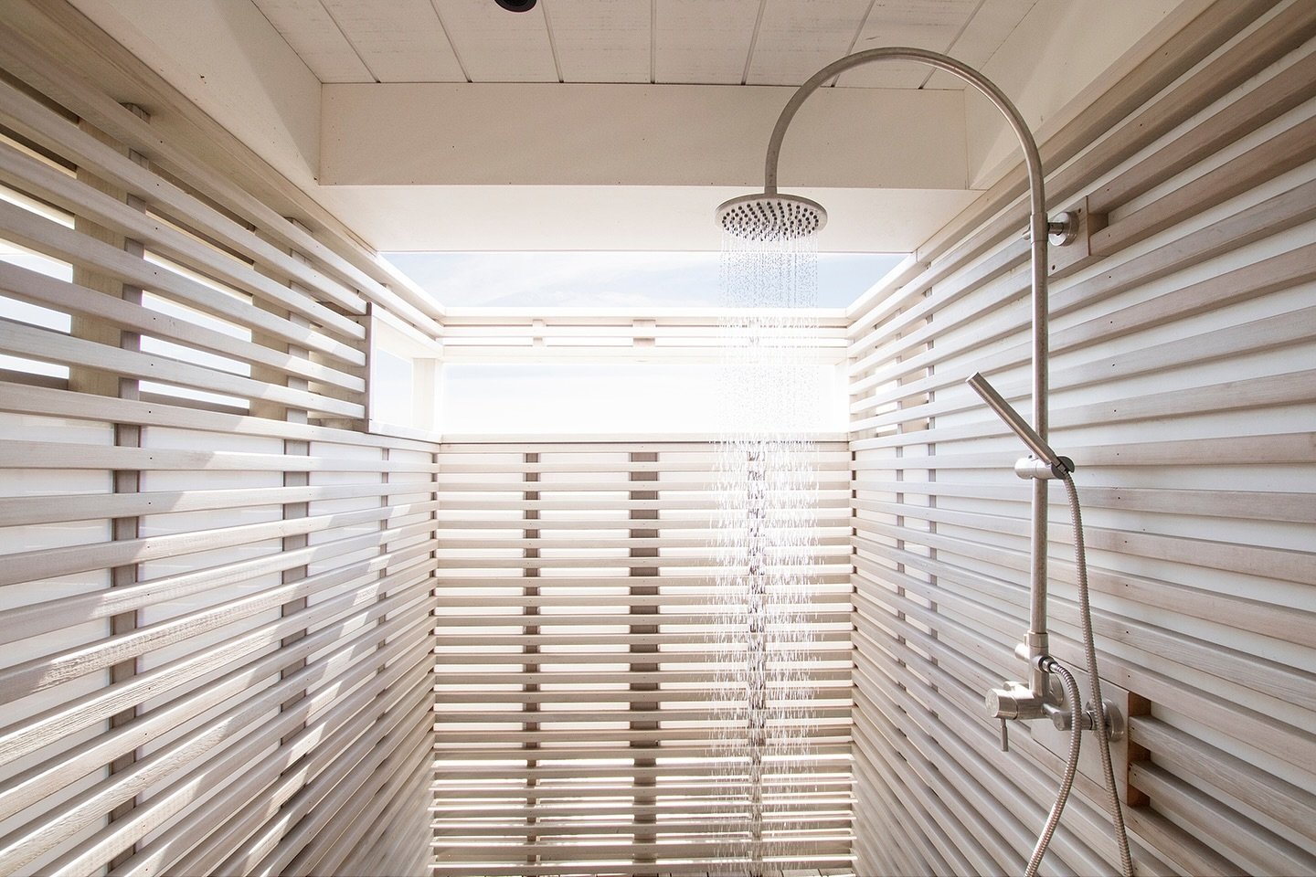 This outdoor shower at the Lido Beach House II provides privacy while using sunlight and natural materials to create a great space to shower after coming back from the beach.

To see more of this project check out Lido Beach House II on our website (
