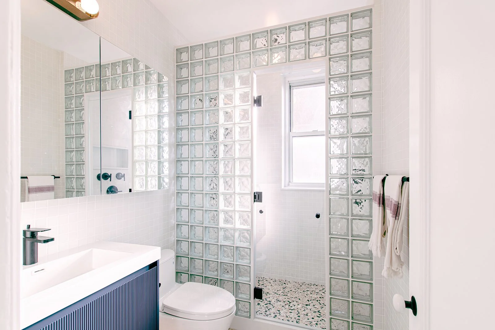 09-res4-resolution-4-architecture-modern-apartment-renovation-nyc-morningside-heights-bath-glass-block-shower.jpg