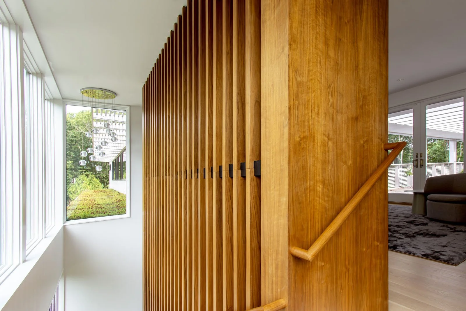 custom-modern-modular-prefab-hamptons-home-ny-architects-summer-house-stair-design-walnut-slatted-wall-green-roof