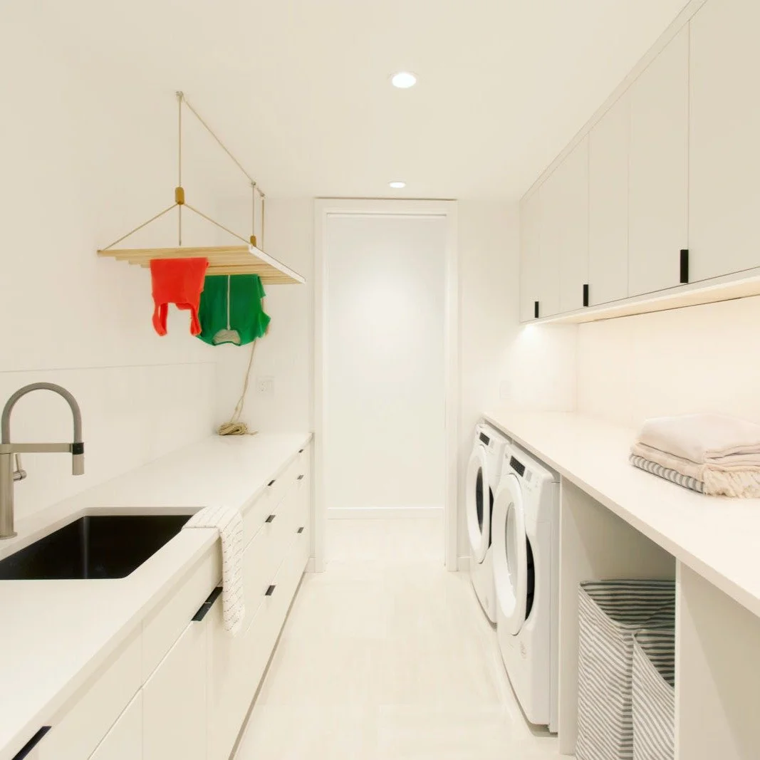 How to design a laundry room that keeps up with family life?

At our MODERN MODULAR Northwest Woods Residence, this basement laundry room was designed for a young, growing family with three young kids&mdash;handling pool towels and beach gear in summ