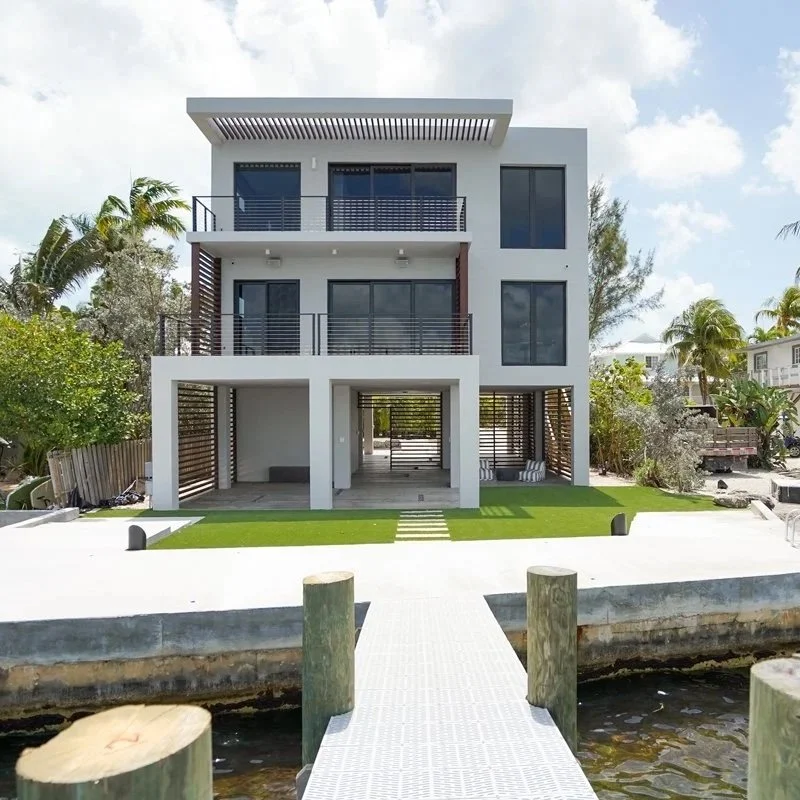 Key Largo Residence. New build in the Florida Keys.

A house shaped by climate and constraints as much as by program. The design reused an existing concrete structure from previous owners and is organized to manage sun, sea, storms, and ventilation w