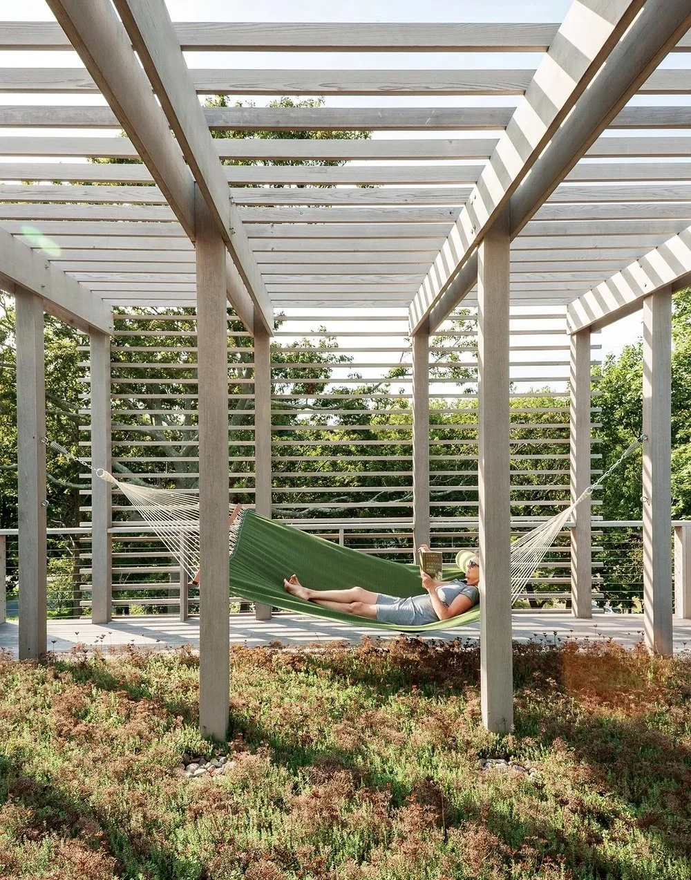 Seasonal shift.

As the landscape changes, so does the experience of the house&mdash;more time outside, longer light, and different patterns of use.

Designing for that variability is part of the process.

Slides:
1. MODERN MODULAR Fishers Island Hou
