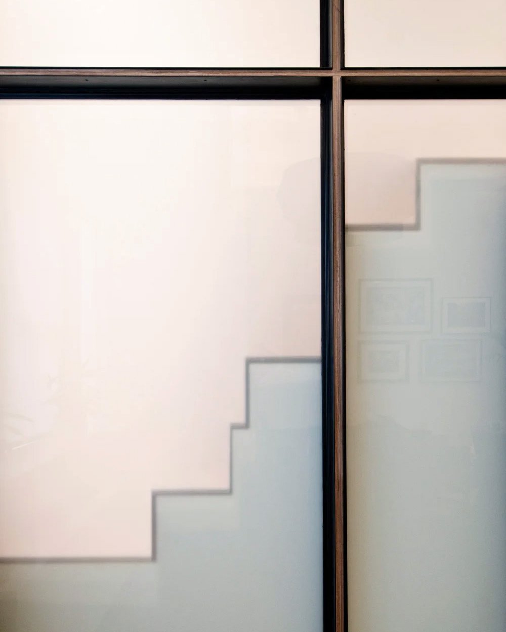 A little room to grow.

At Loft-Within-A-Loft, an alternating-tread stair zigzags behind a translucent glass wall to reach a child's sleeping loft above a playroom. The arrangement gives the kids their own spaces while separating them from the apartm