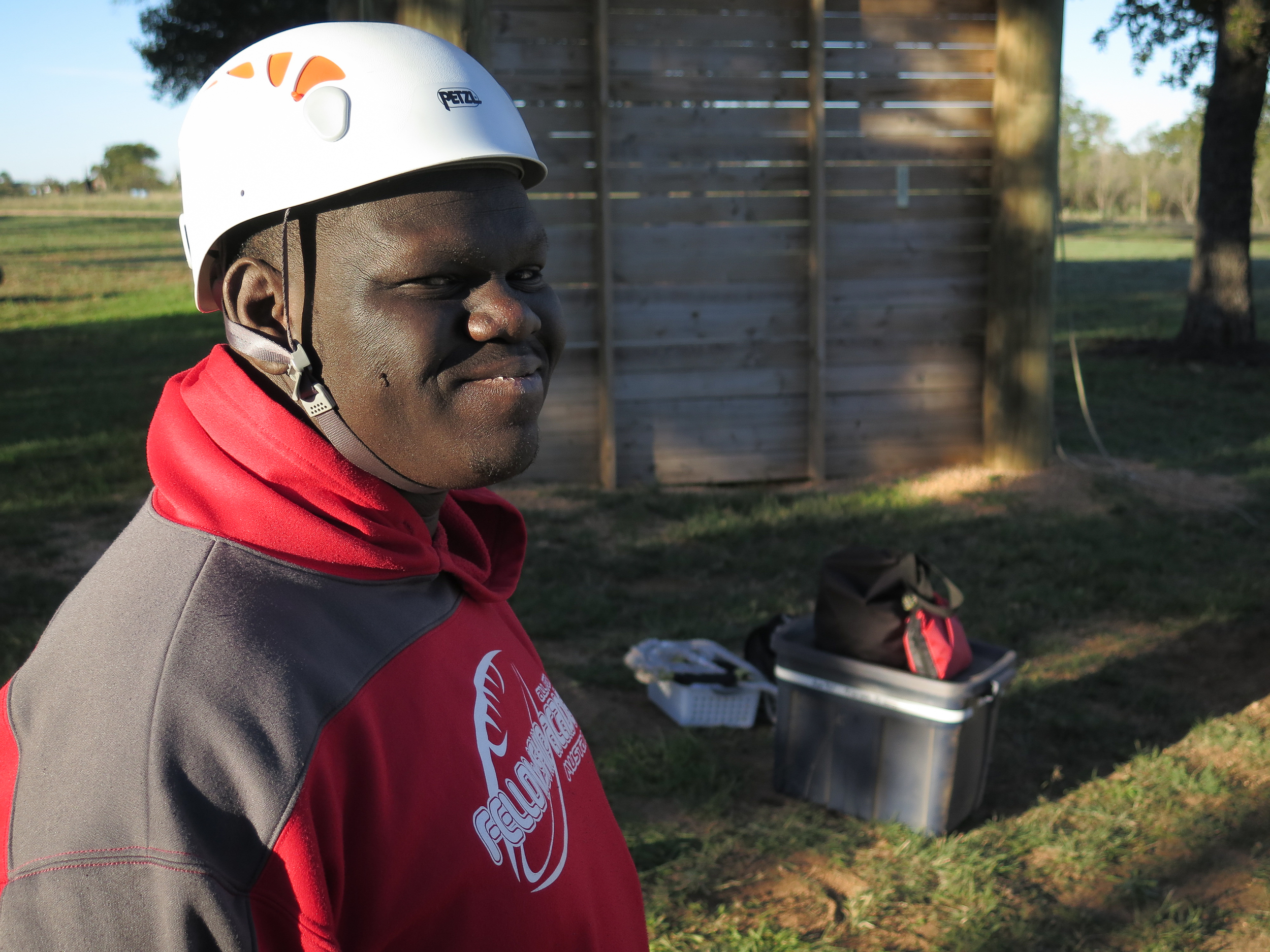 (Somiari about to do his first 40 foot high element climb on our Intro Trip)