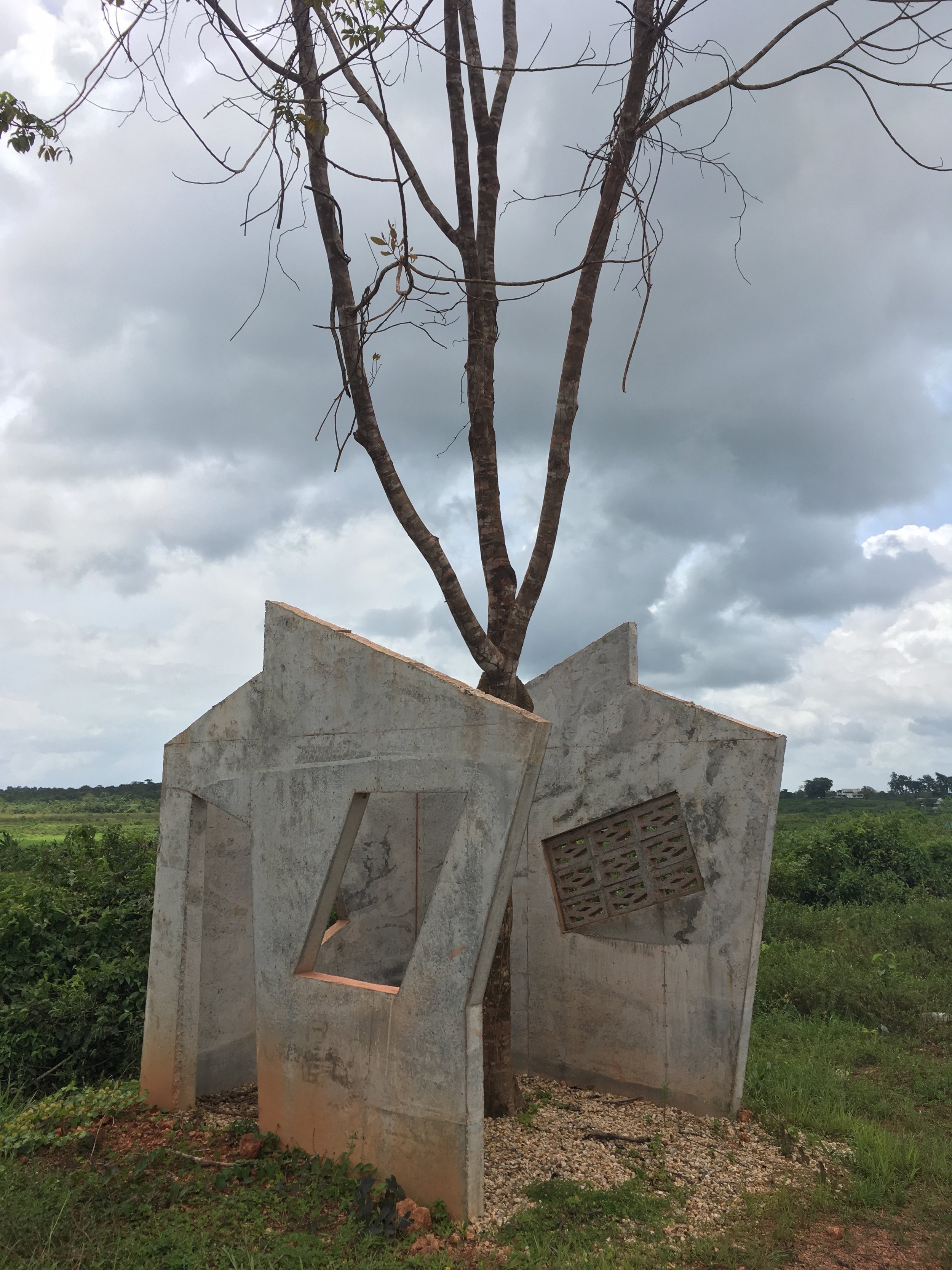  Dutch artist Feiko Becker's  Afu-Osu  (half-house in Ndyuka) was a part of the artist's broader reflection on failure. He noticed many unfinished houses in Moengo and thought these were failed projects. When he later discovered that it often takes a