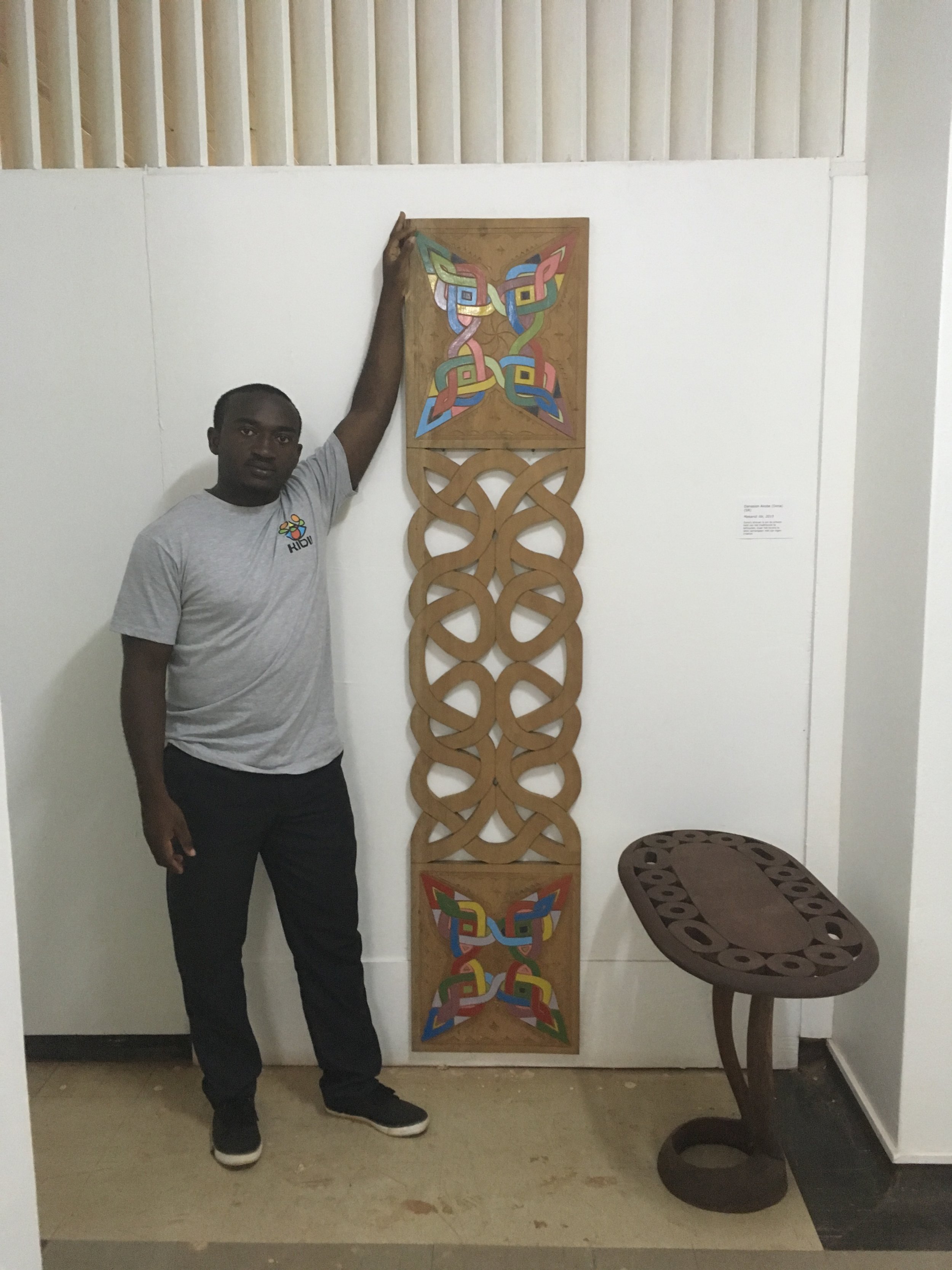  Inside CAMM: Wadell Akobe with tembe (traditional Maroon art) made by him and his father, Dona Akobe. 