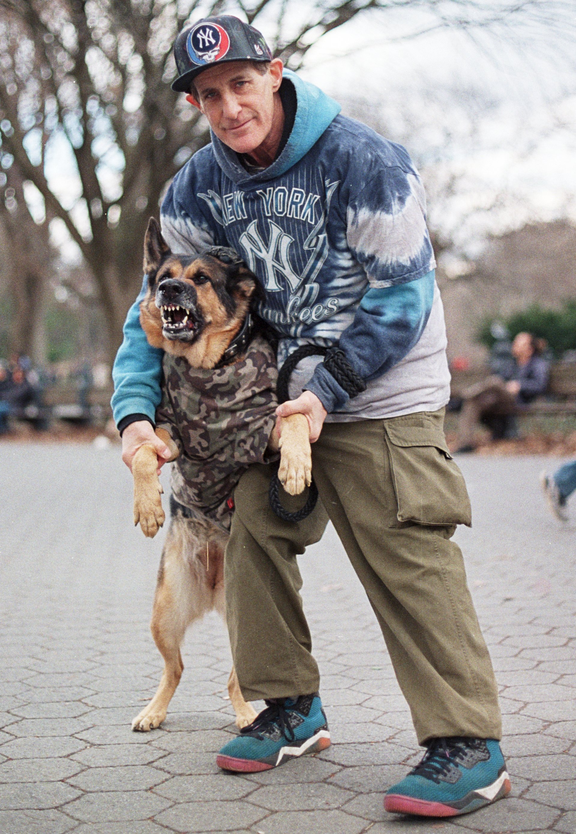 Man Holds Dog Central Park Cropped Nikon F Color Film copy.jpg