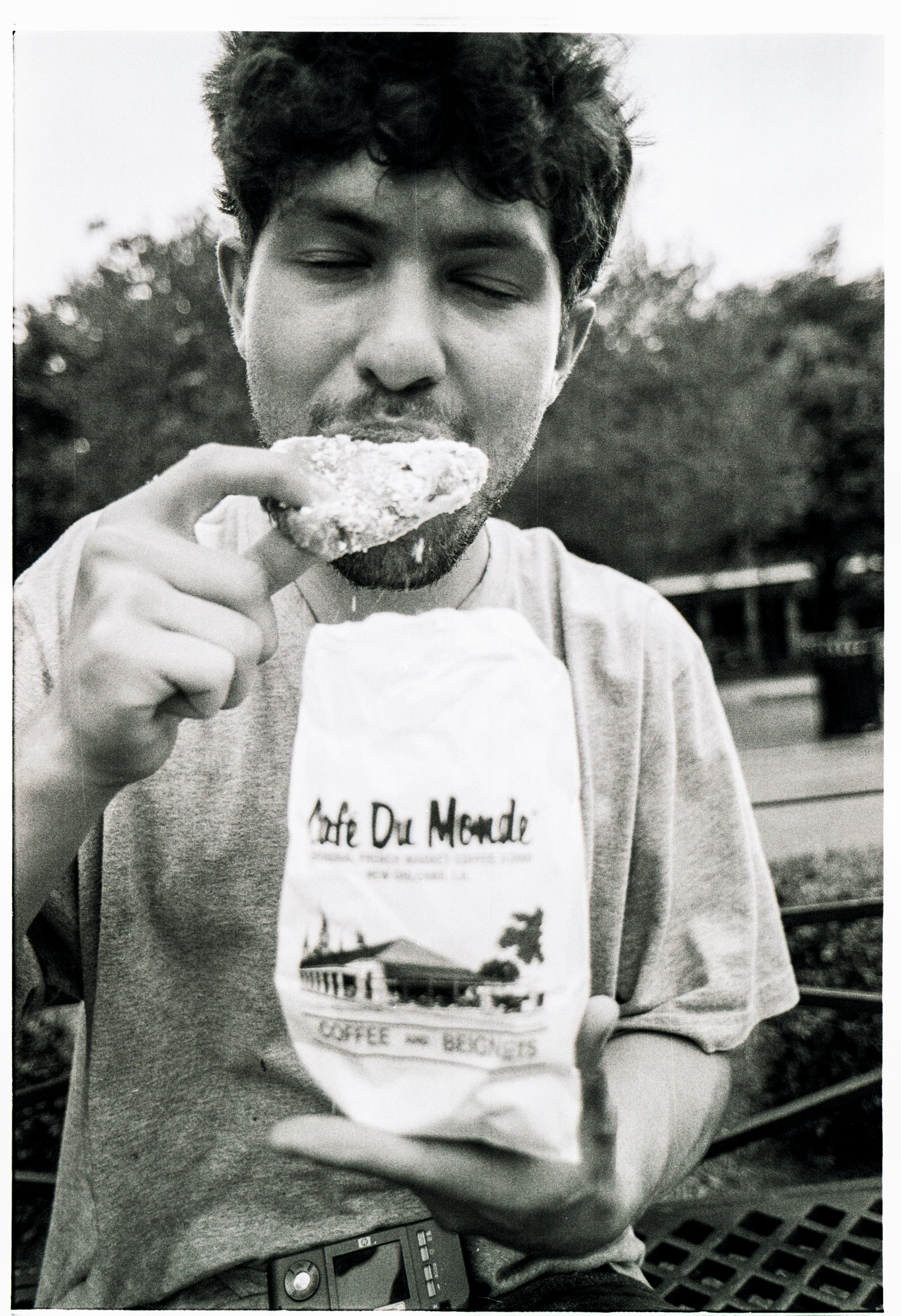 Joey Eating Beignet New Orleans Nikon F B&W Film.jpg